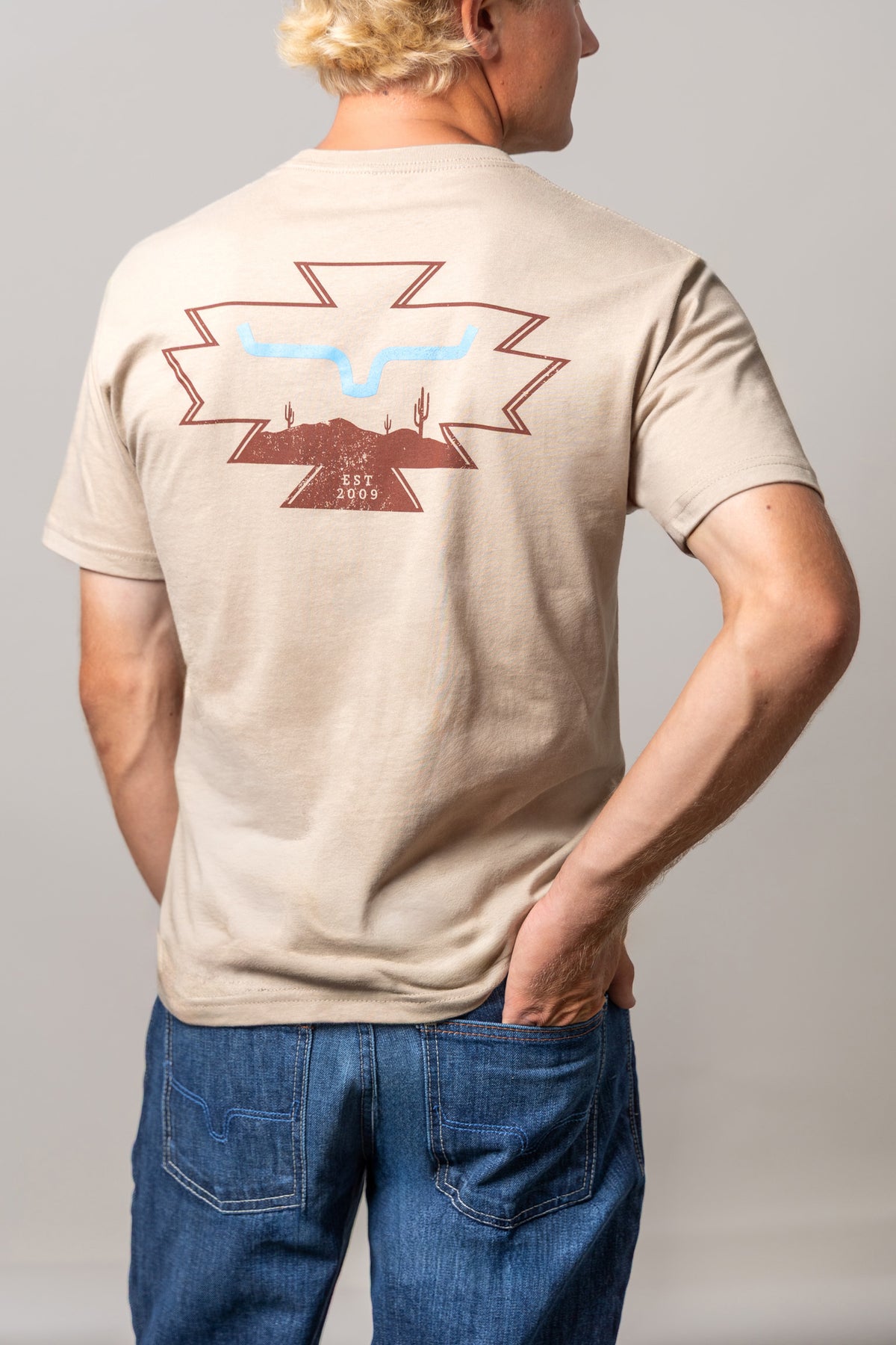 Kimes Ranch Long Live, back view, Tan shirt with a back graphic of the Kimes Ranch logo with cacti and EST 2009