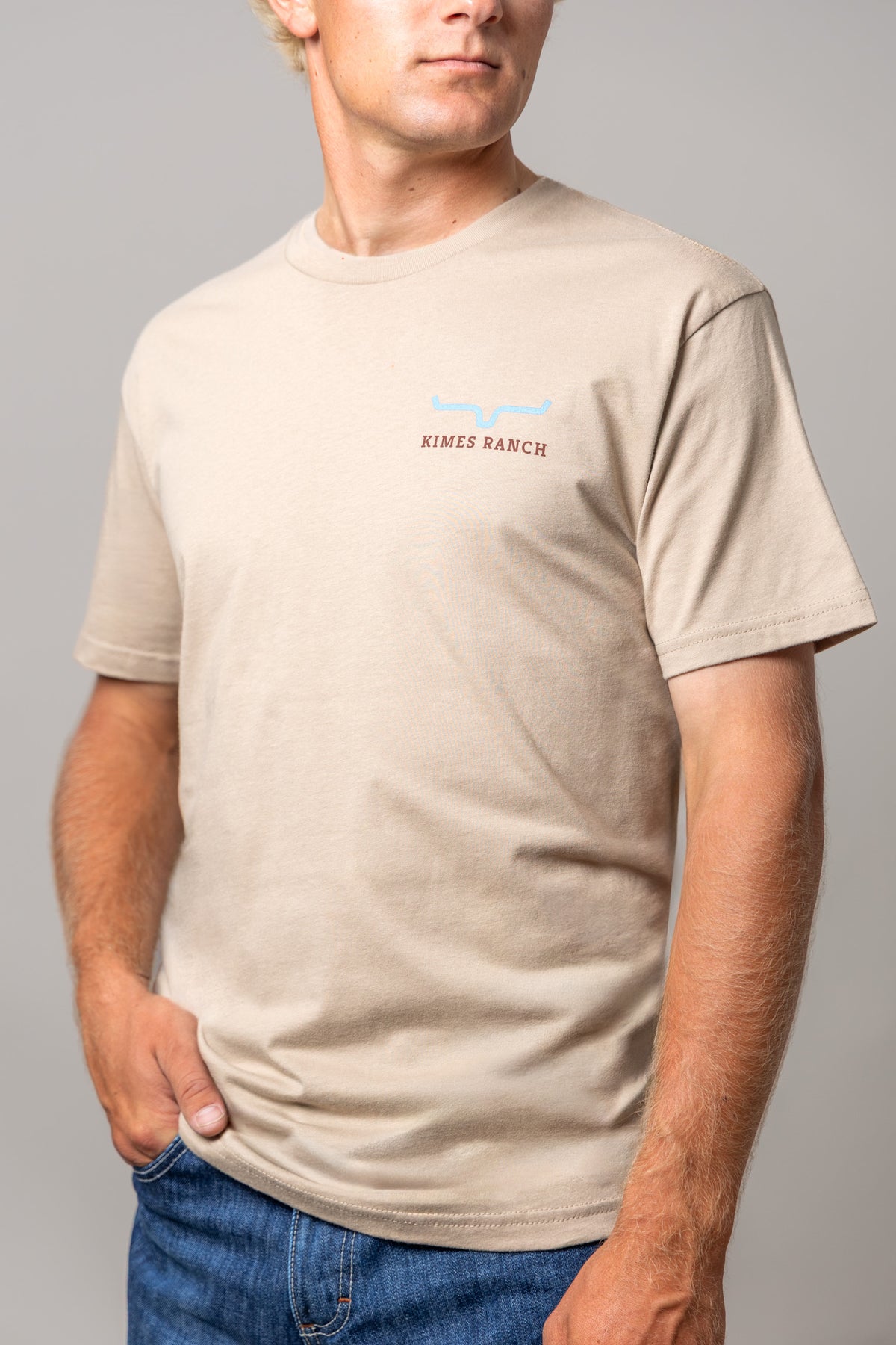 Kimes Ranch Long Live shirt in Tan with a chest logo featuring a blue steer mark and KIMES RANCH text