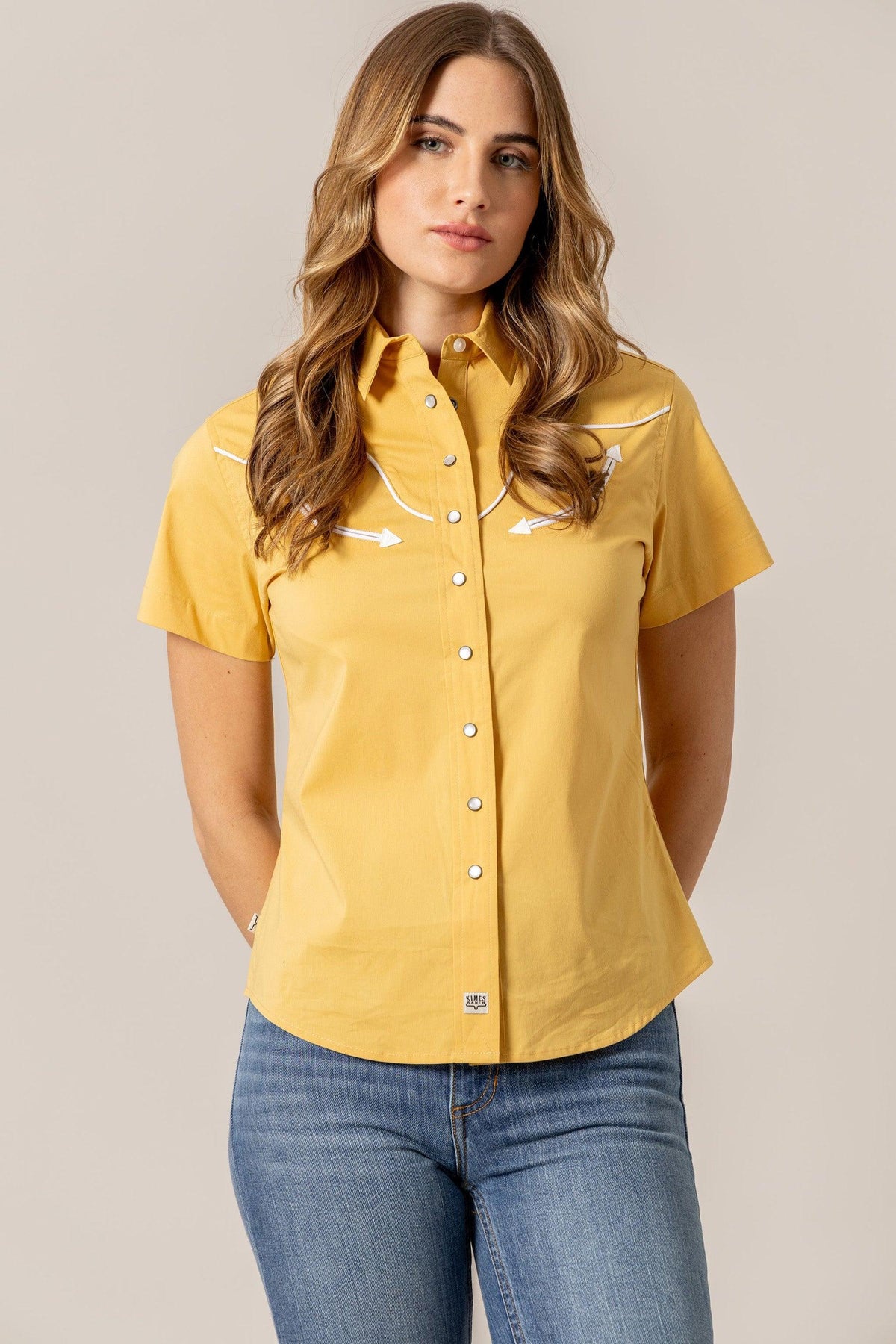 Kimes Ranch Logo Horn Snap top in Gold with white contrast stitching and arrow details