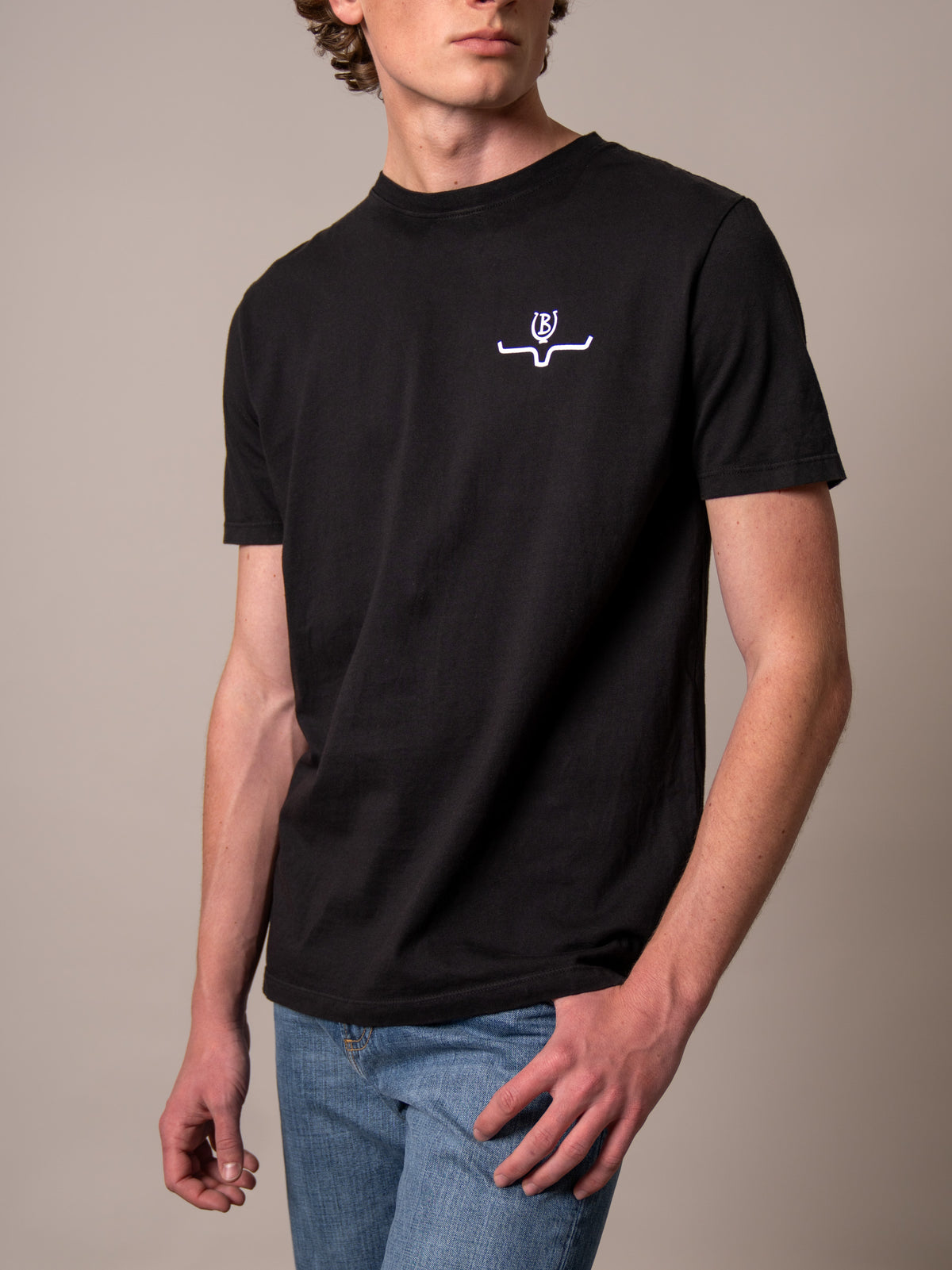 Kimes Ranch Lucky B Bucking shirt in Black with a white logo on the chest