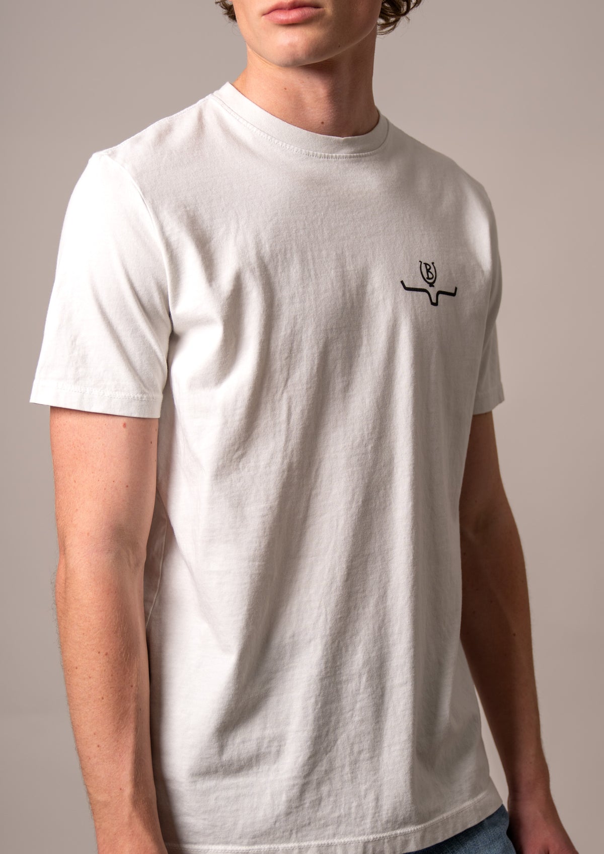 Kimes Ranch Lucky B Bucking shirt in Natural with a crew neck and short sleeves and a Kimes Ranch logo on the chest
