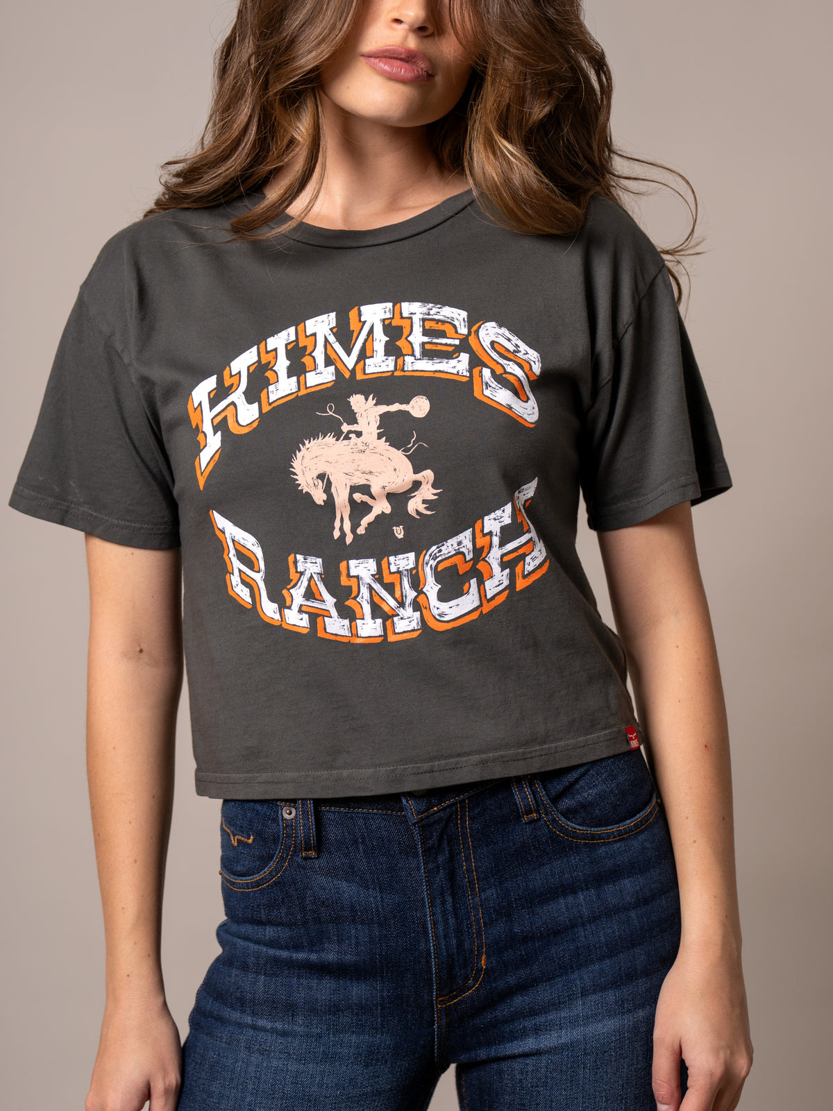 Kimes Ranch Lucky B Bucking shirt in Pepper with a graphic of a cowboy on a bucking horse and Kimes Ranch text