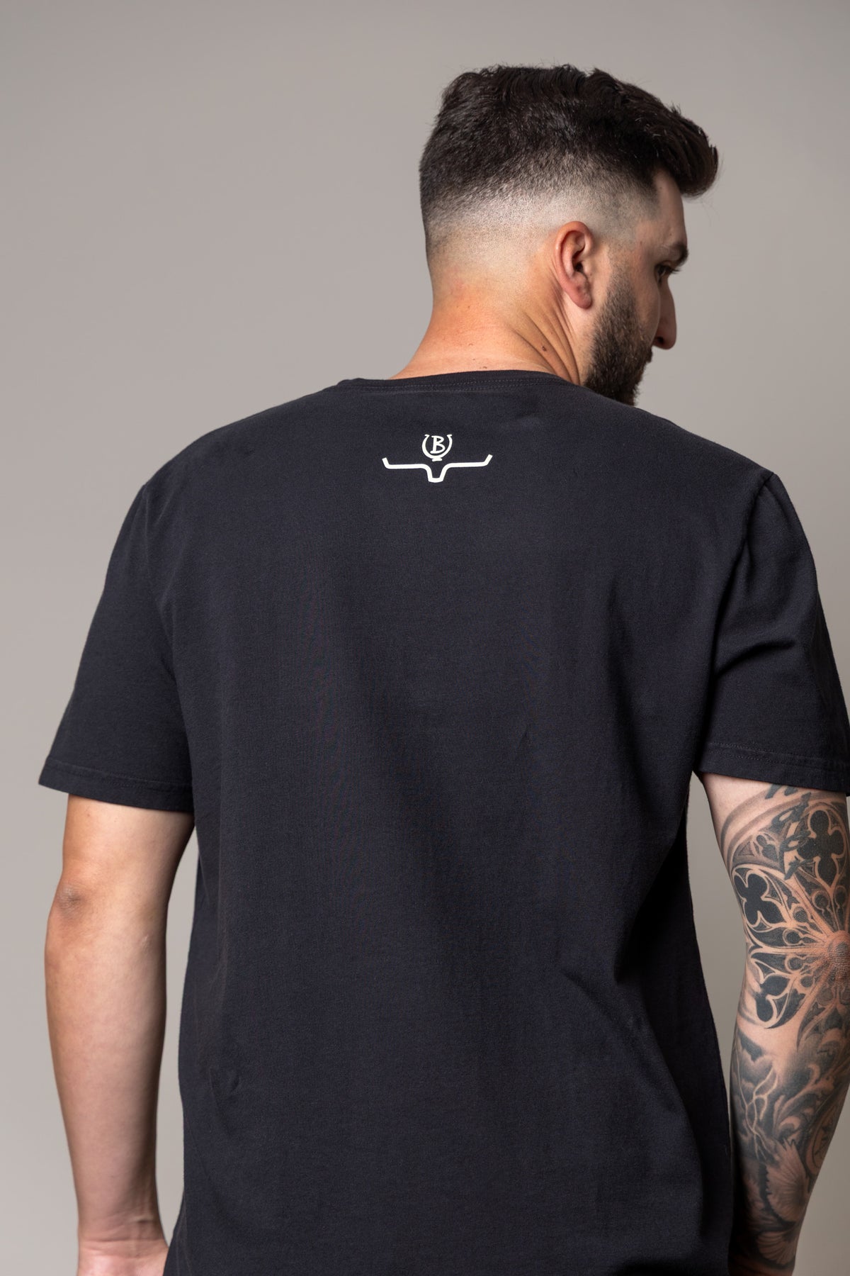 Kimes Ranch Lucky B Bull Dogger shirt in Black, back view, with the Kimes Ranch logo at the back yoke