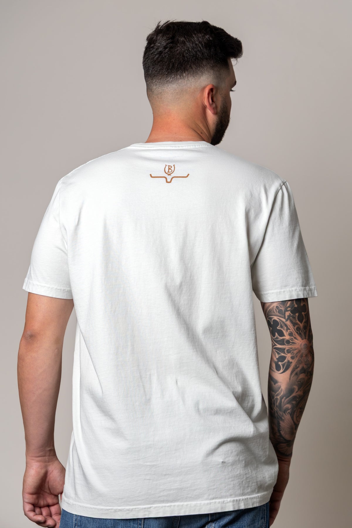 Kimes Ranch Lucky B Bull Dogger shirt in Muted White, back view, with a small logo at the back yoke