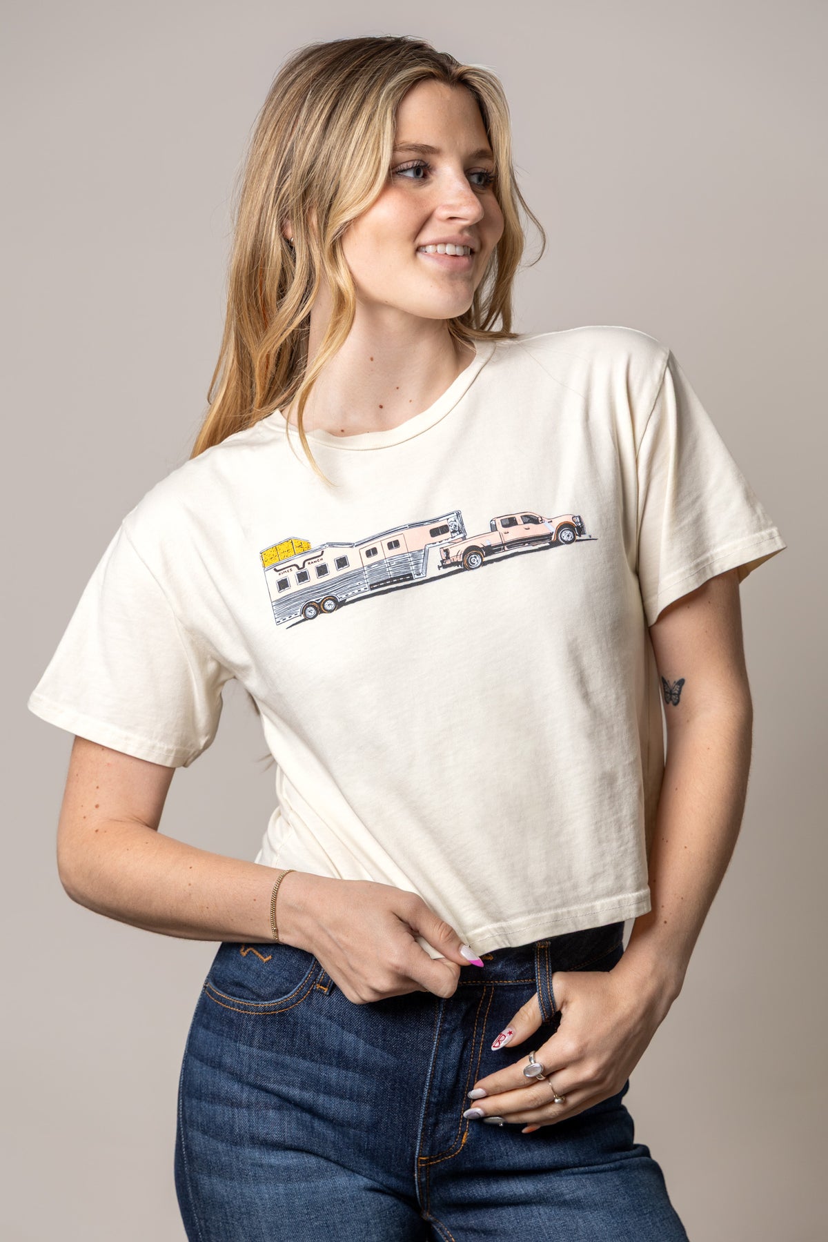 Kimes Ranch Lucky B Hauler shirt in Ivory with a graphic of a horse trailer being towed by a truck