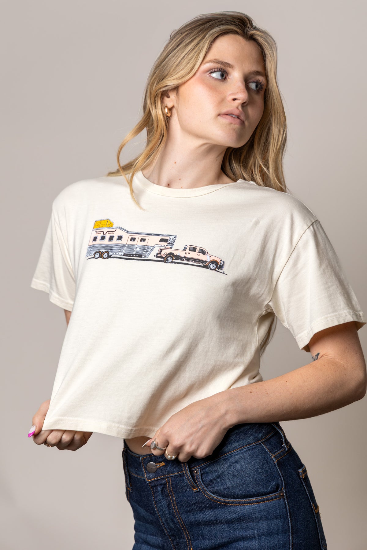 Kimes Ranch Lucky B Hauler shirt in Ivory with a graphic of a horse trailer being towed by a truck