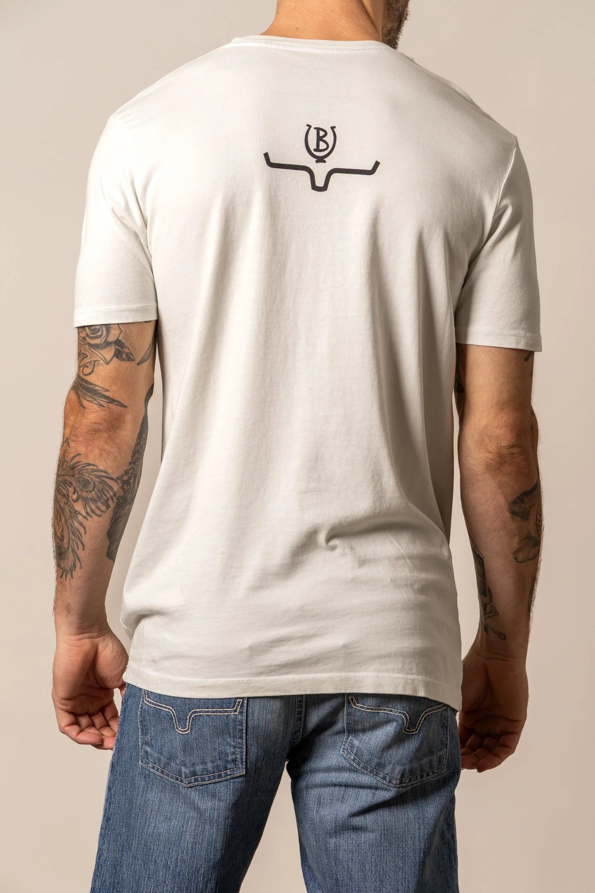 Kimes Ranch Lucky B Truck shirt in Natural, back view, with a back yoke graphic of the Kimes Ranch logo