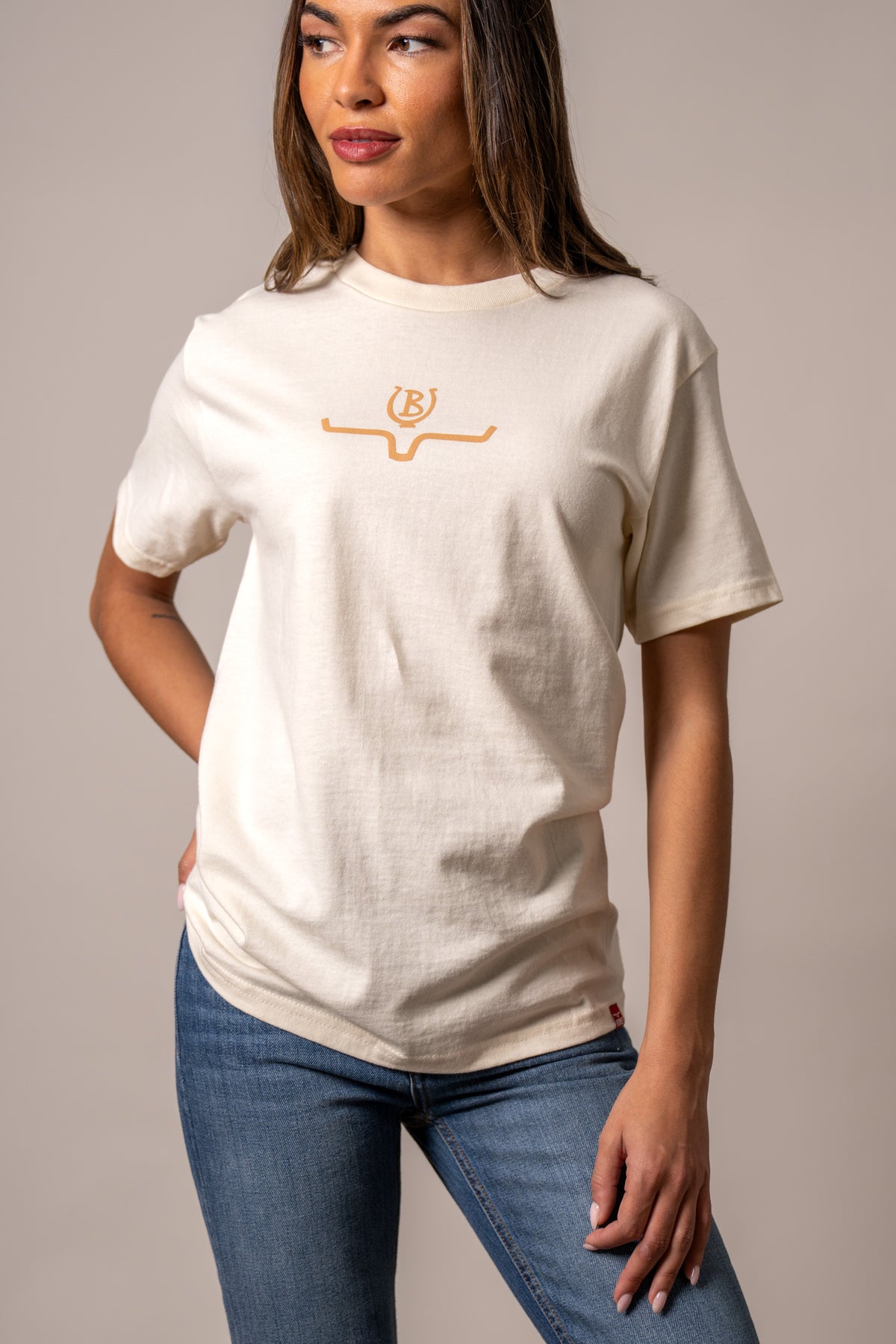 Kimes Ranch Lucky B Saddle Cream short sleeve shirt with a small orange logo on the chest
