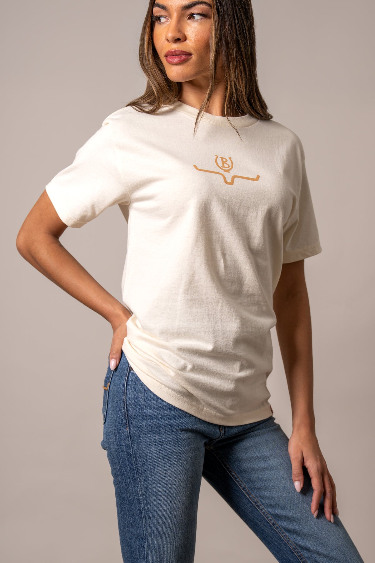 Kimes Ranch Lucky B Saddle cream short sleeve shirt with a gold embroidered logo on the chest