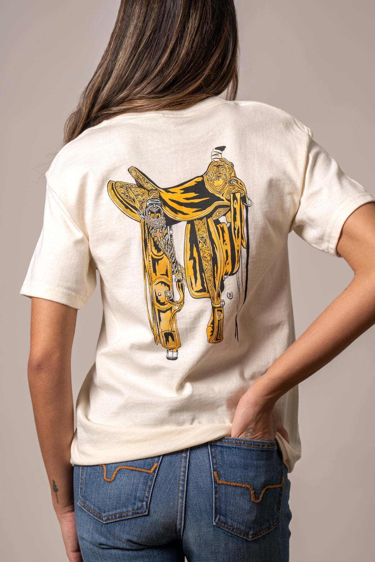 Kimes Ranch Lucky B Saddle, back view, shirt back with large yellow and black saddle graphic print