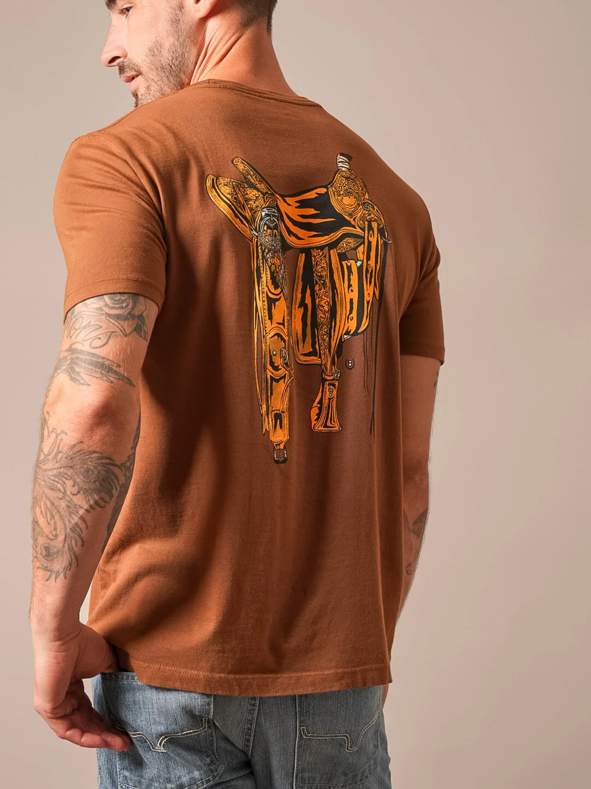 Kimes Ranch Lucky B Saddle shirt in Dark Brown, back view, with a large western saddle graphic on the back