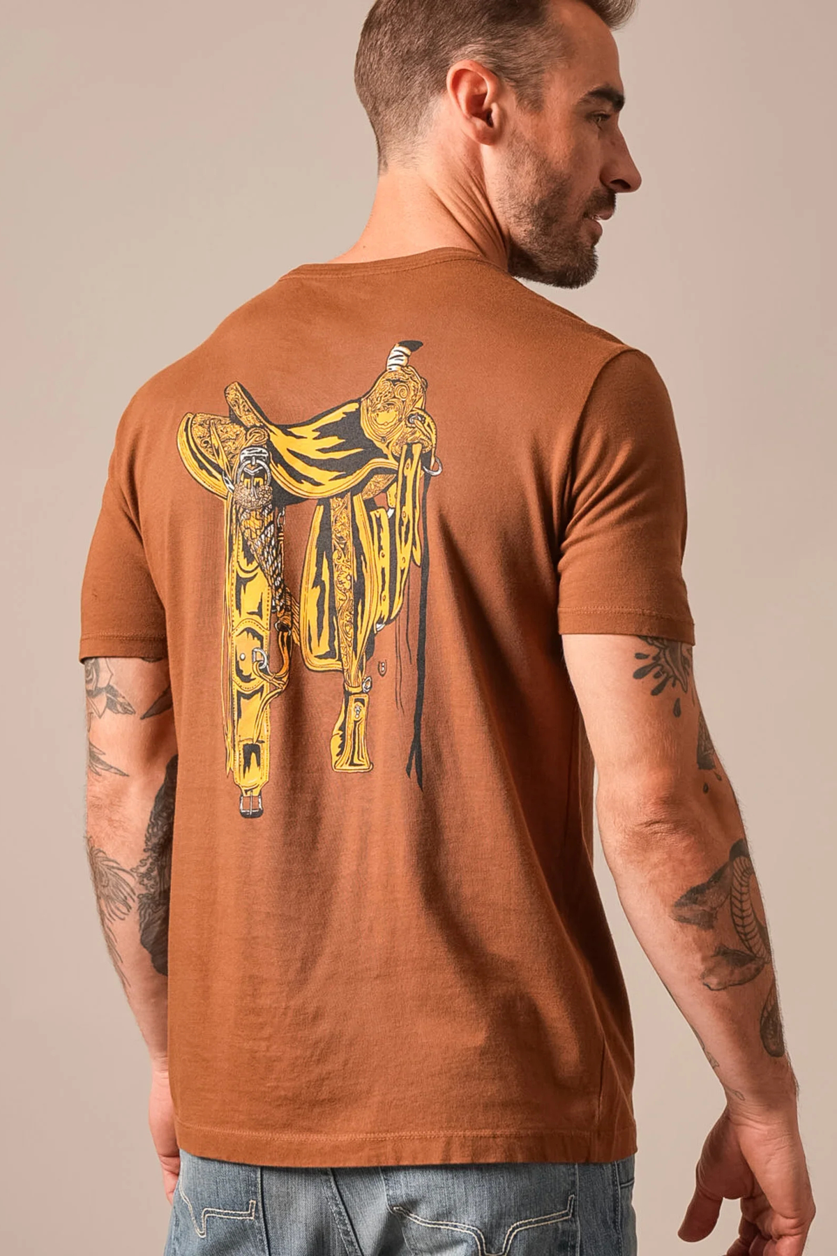 Kimes Ranch Lucky B Saddle shirt in Dark Brown, back view, with a large yellow western saddle graphic on the back