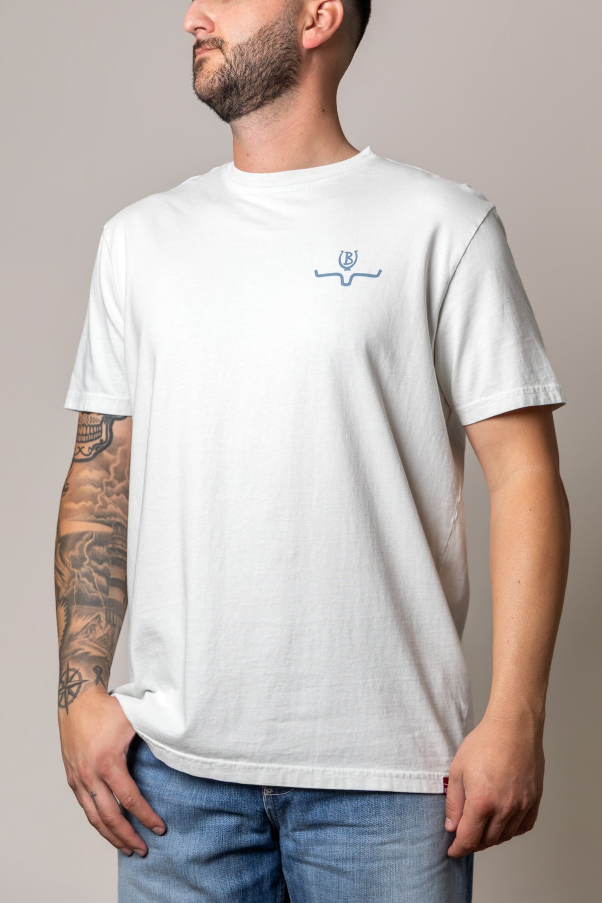 Kimes Ranch Lucky B Statewide shirt in Muted White with a small blue logo on the chest