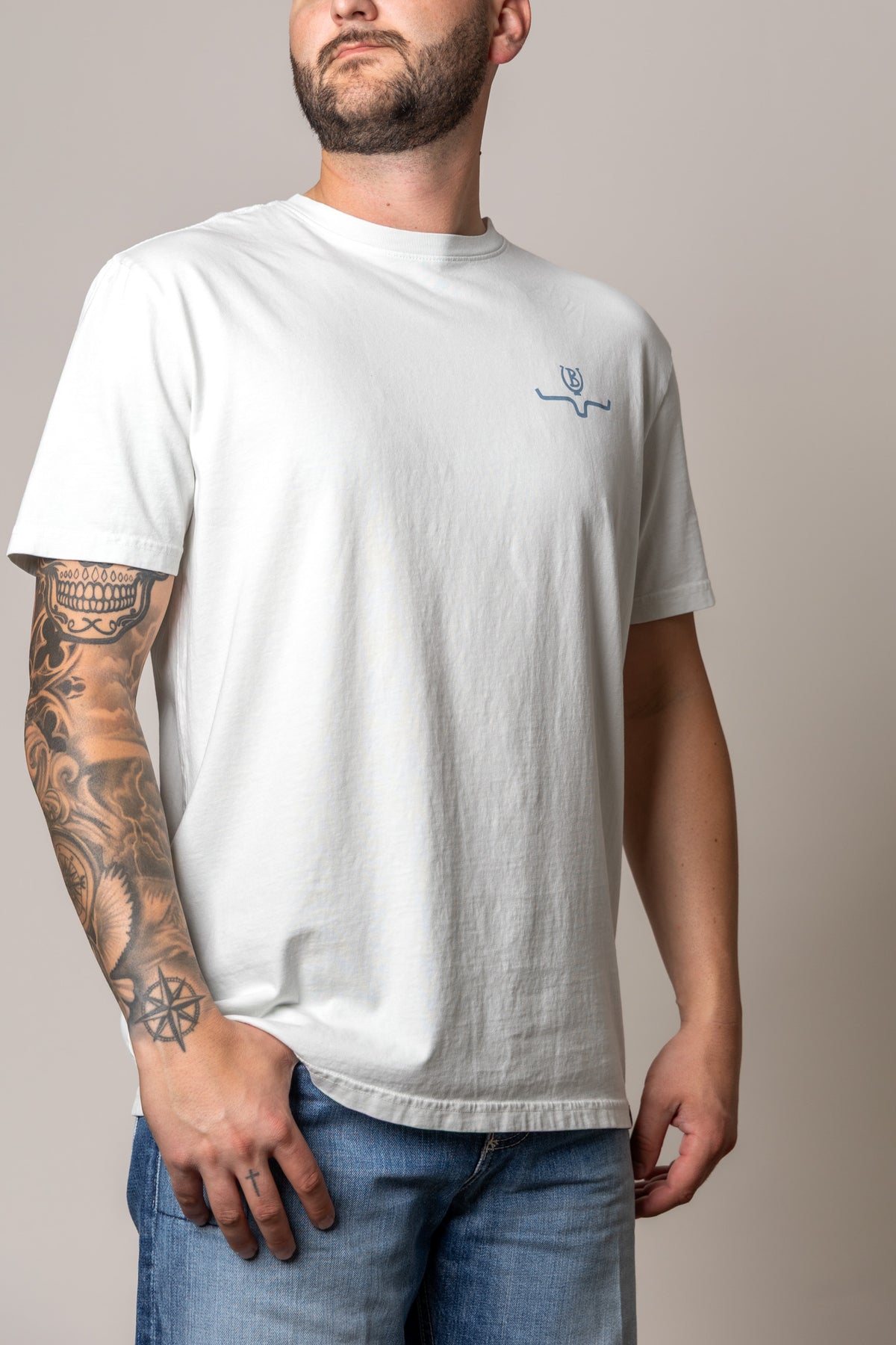 Kimes Ranch Lucky B Statewide shirt in Muted White, side view, with a small blue logo on the chest