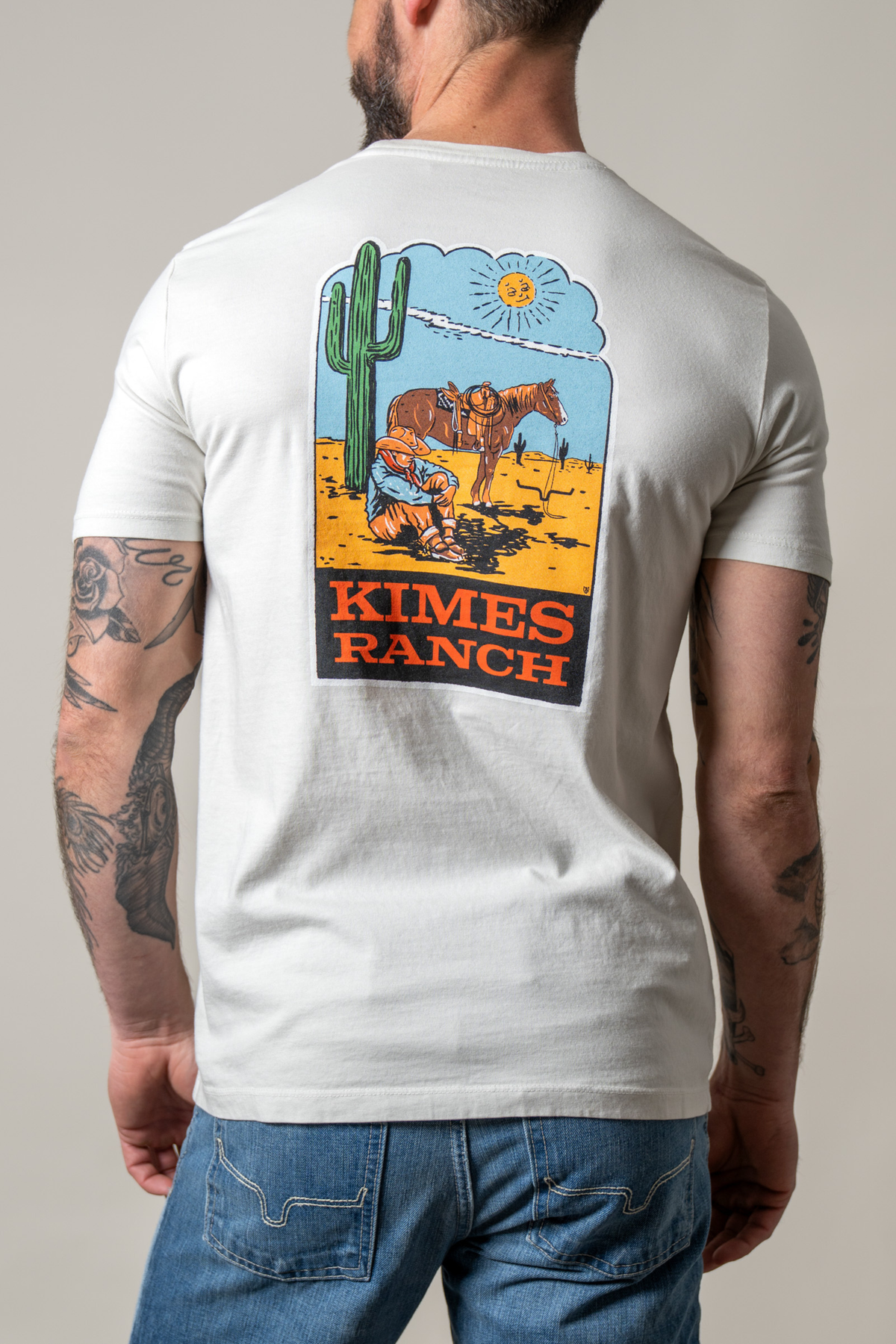 Kimes Ranch Lucky B Sun Had Just Risen shirt in Natural, back view, with a back graphic of a cowboy and horse