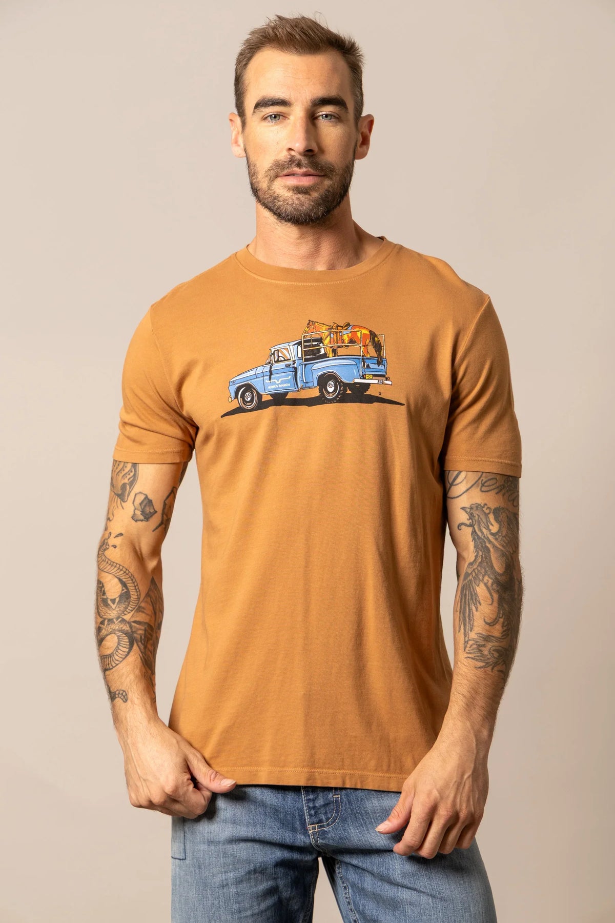Kimes Ranch Lucky B Truck shirt in Work Wear Brown with a graphic of a blue truck carrying a horse