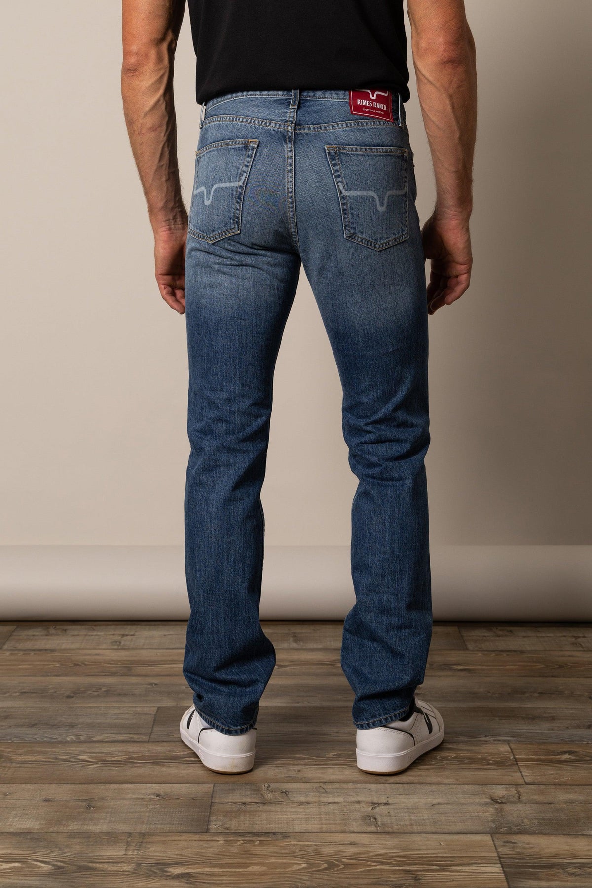 Kimes Ranch Luke Mid Wash Slim Fit jeans with back pockets and red logo patch