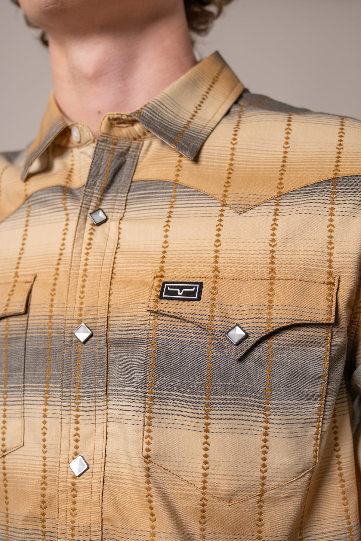 Kimes Ranch Lyle dress shirt in Black, close-up, with a plaid pattern and silver-tone snap buttons