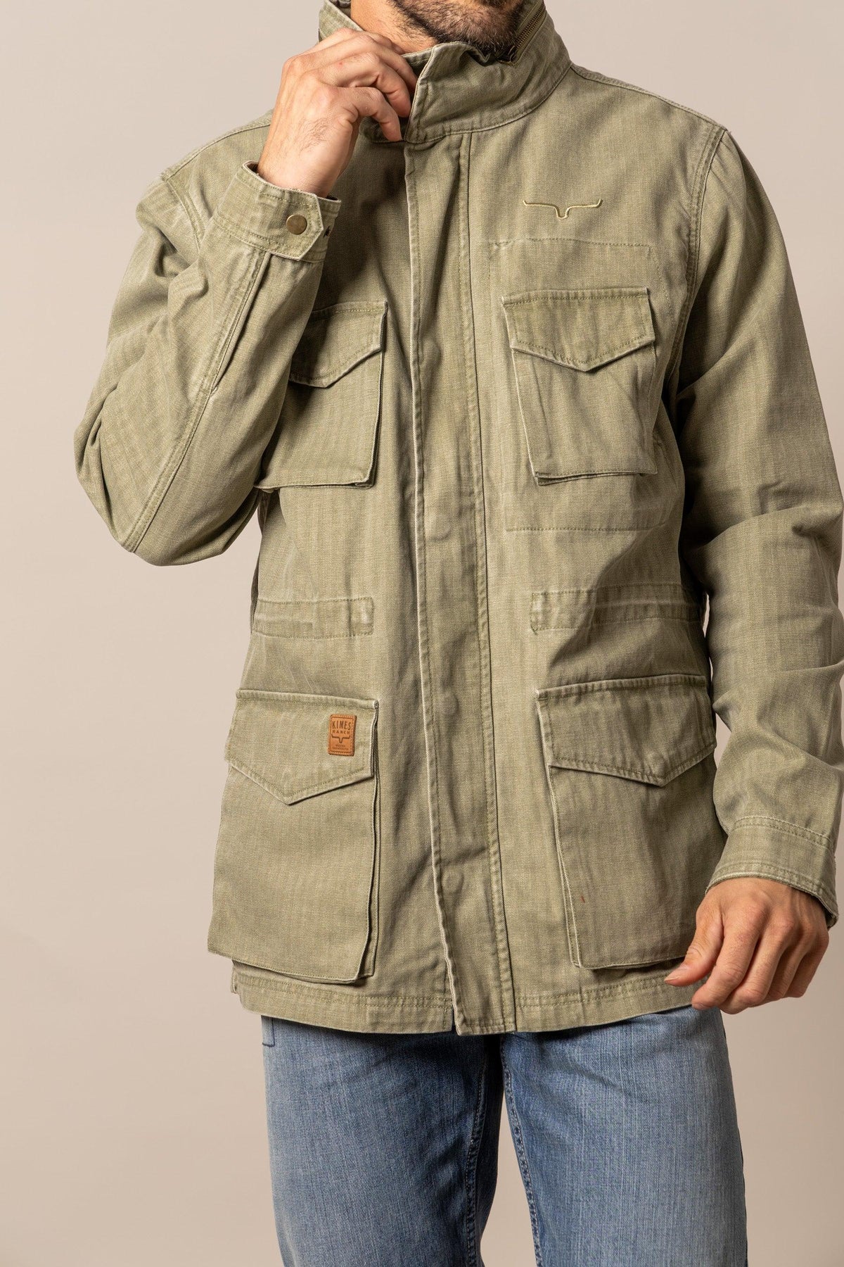 Kimes Ranch M65 S Jacket in Army Green with four front pockets and a logo patch