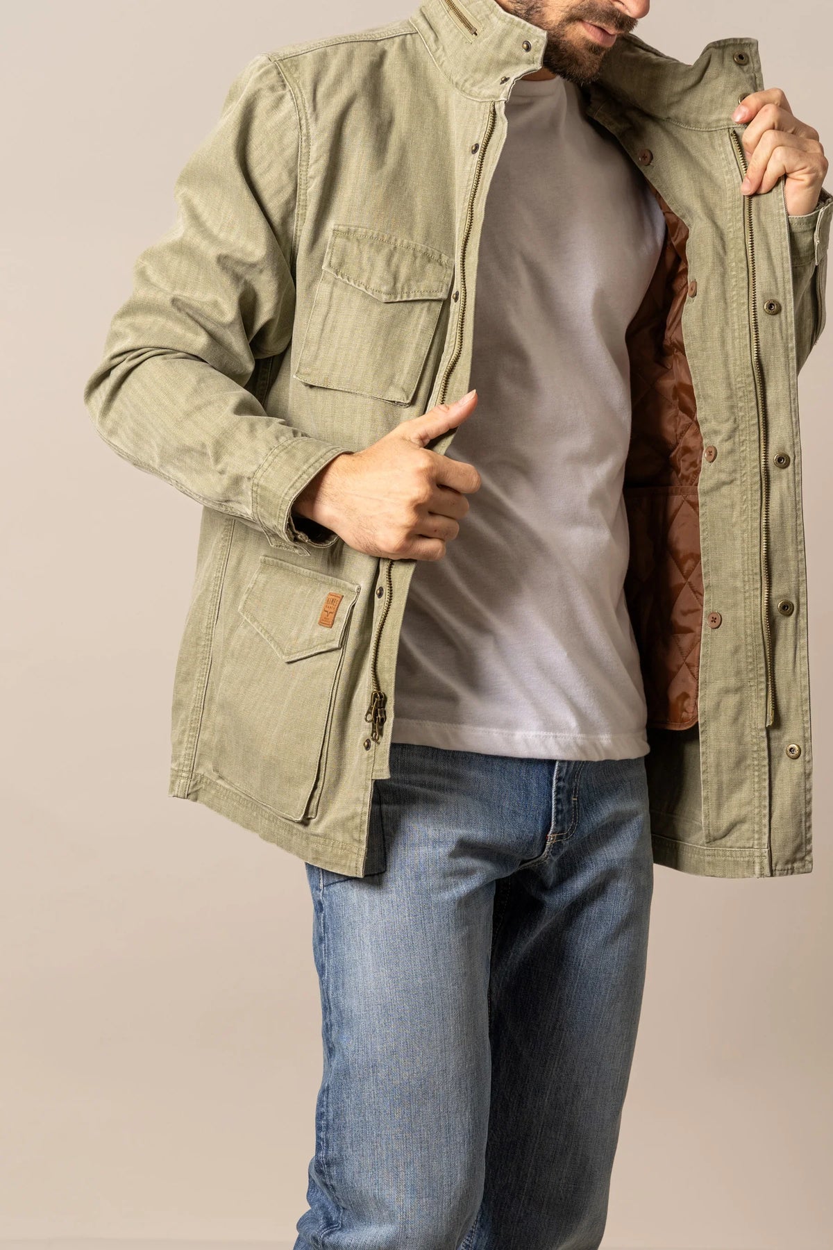 Kimes Ranch M65 S Jacket in Army Green with zip front, flap pockets, and quilted brown lining