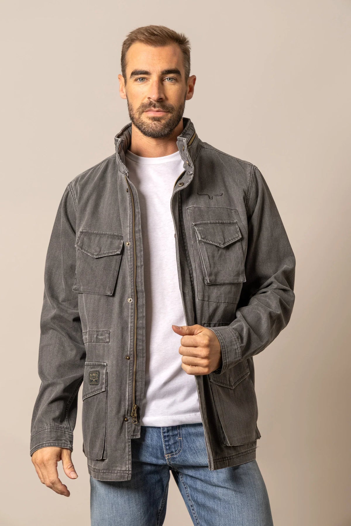 Kimes Ranch M65 S Jacket in Black with a stand collar, zip front, and flap pockets