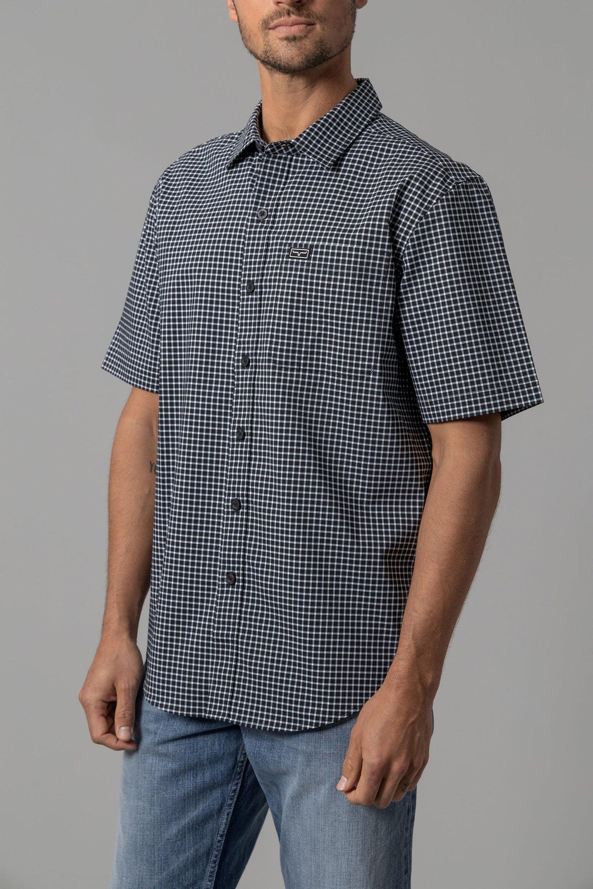 Kimes Ranch MC Cooper short sleeve dress shirt in Black with a white check pattern and chest pocket
