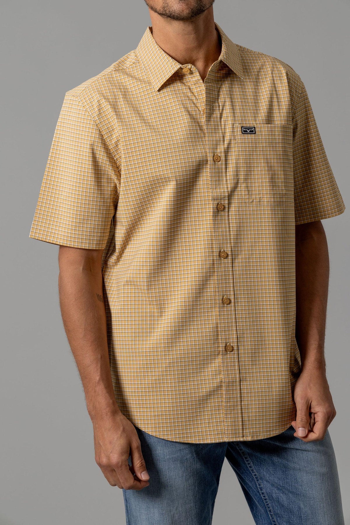 Kimes Ranch MC Cooper short sleeve dress shirt in Gold with a check pattern and chest pocket