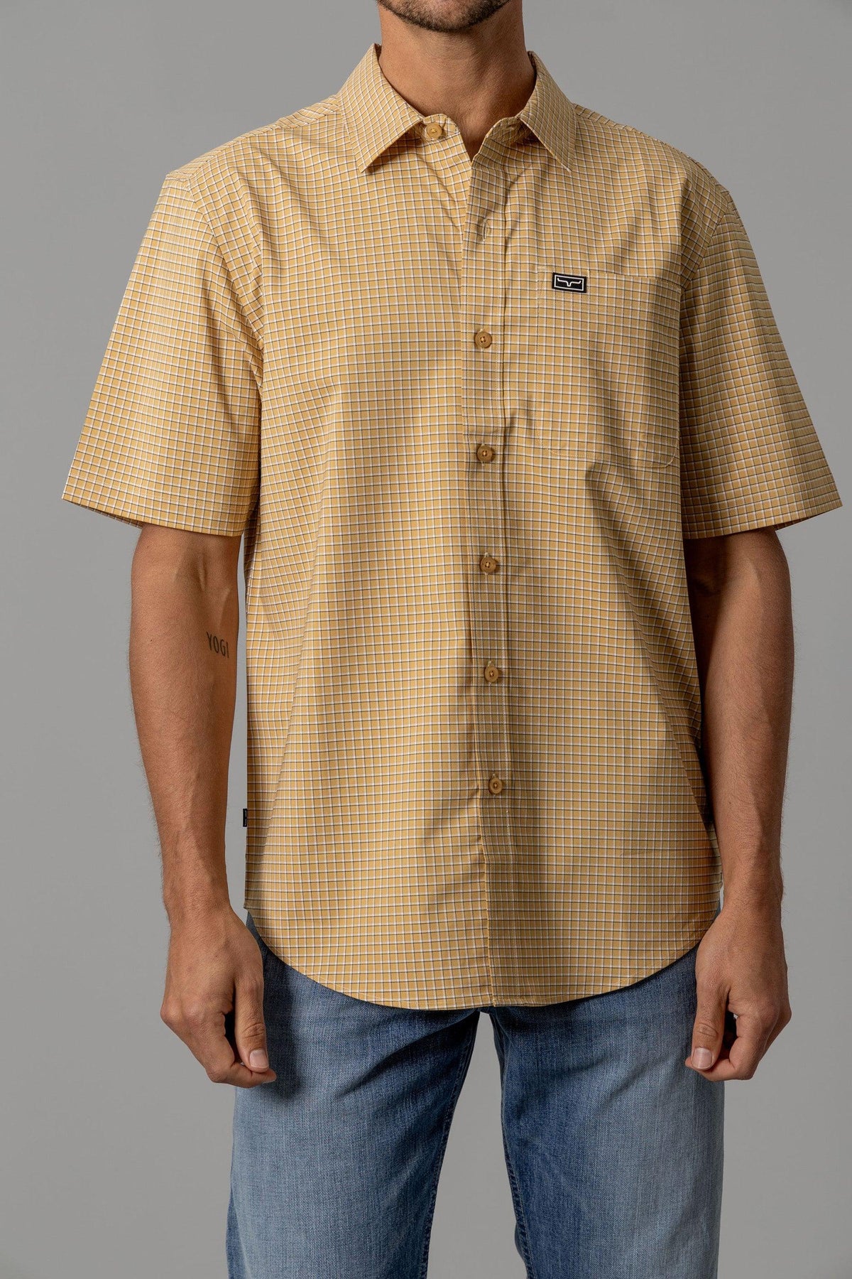 Kimes Ranch MC Cooper short sleeve dress shirt in Gold with a check pattern and chest pocket