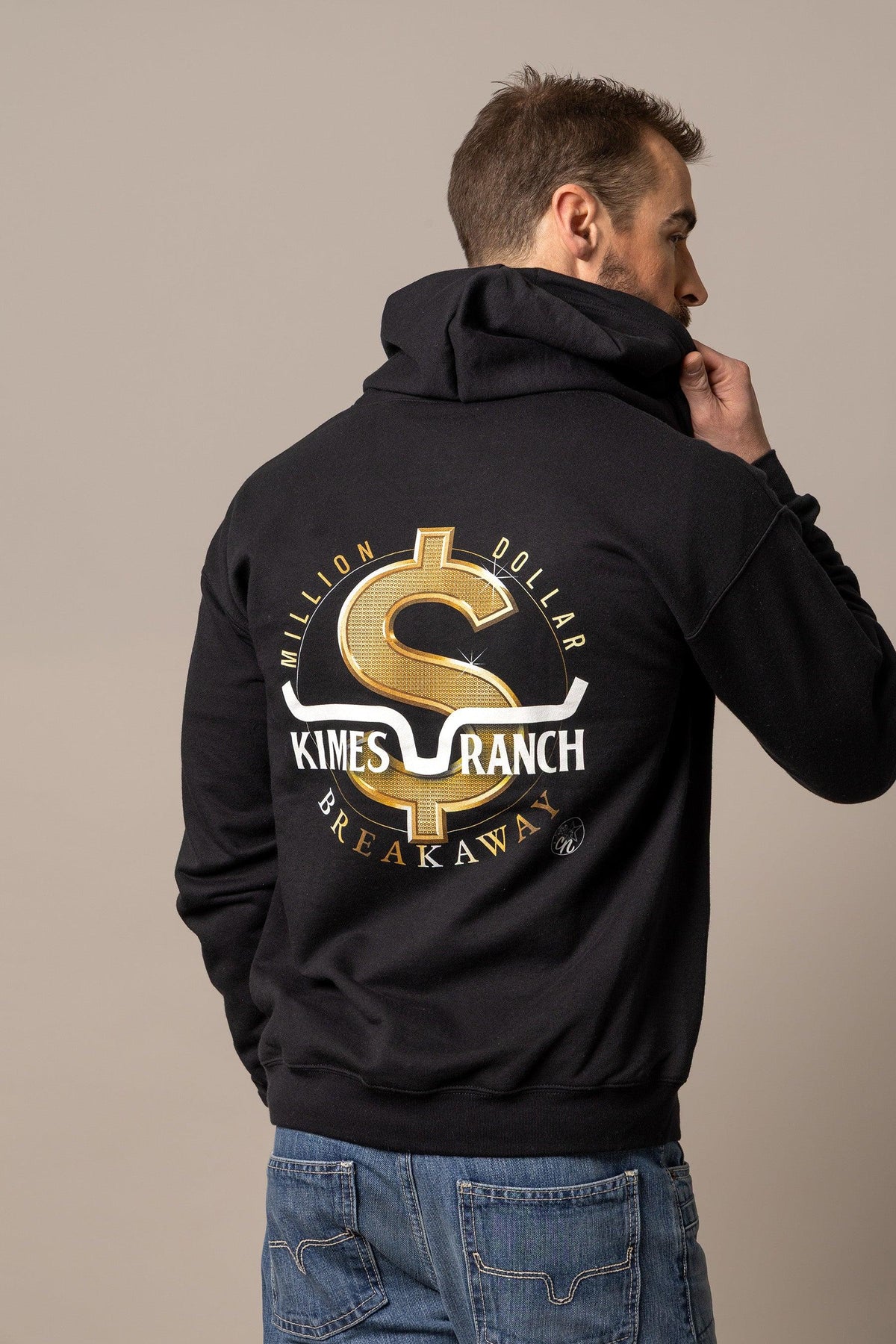 Kimes Ranch MDB Zip Up hoodie in black with a large gold dollar sign graphic and 'Million Dollar Breakaway' text on the back