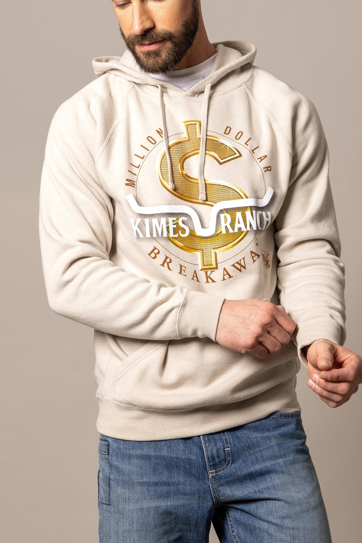 Kimes Ranch MDB Pullover hoodie in oatmeal with a gold dollar sign graphic and Kimes Ranch logo