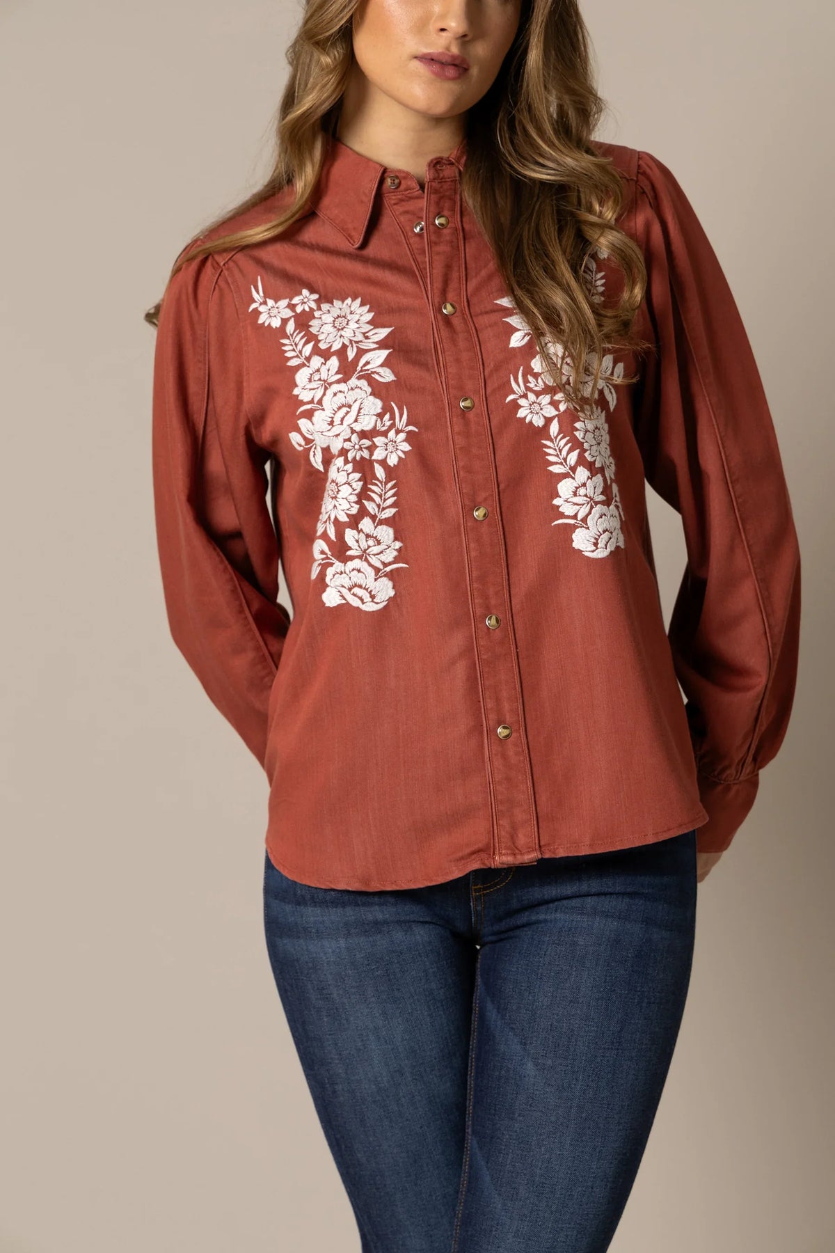 Kimes Ranch Mae top in Burnt Red with white floral embroidery on the front