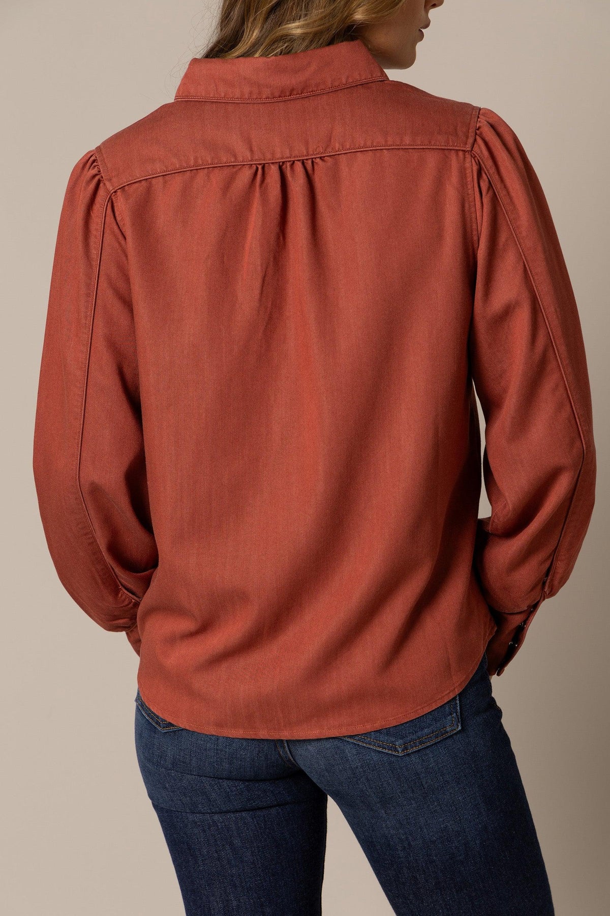 Kimes Ranch Mae top in Burnt Red, back view, with a back yoke and long sleeves