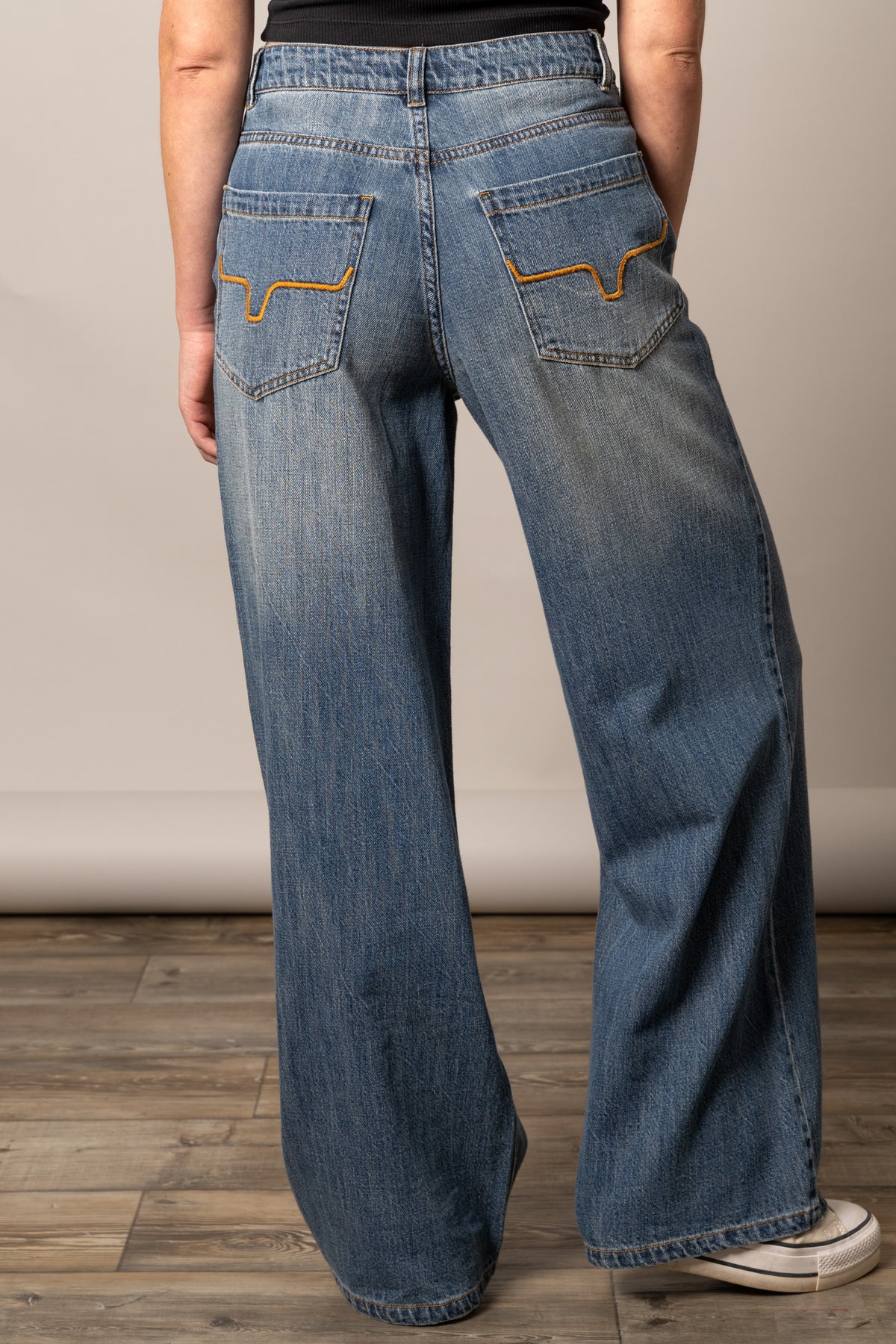 Kimes Ranch Maggie jeans in Antique Wash, back view, with wide leg silhouette and signature back pocket stitching