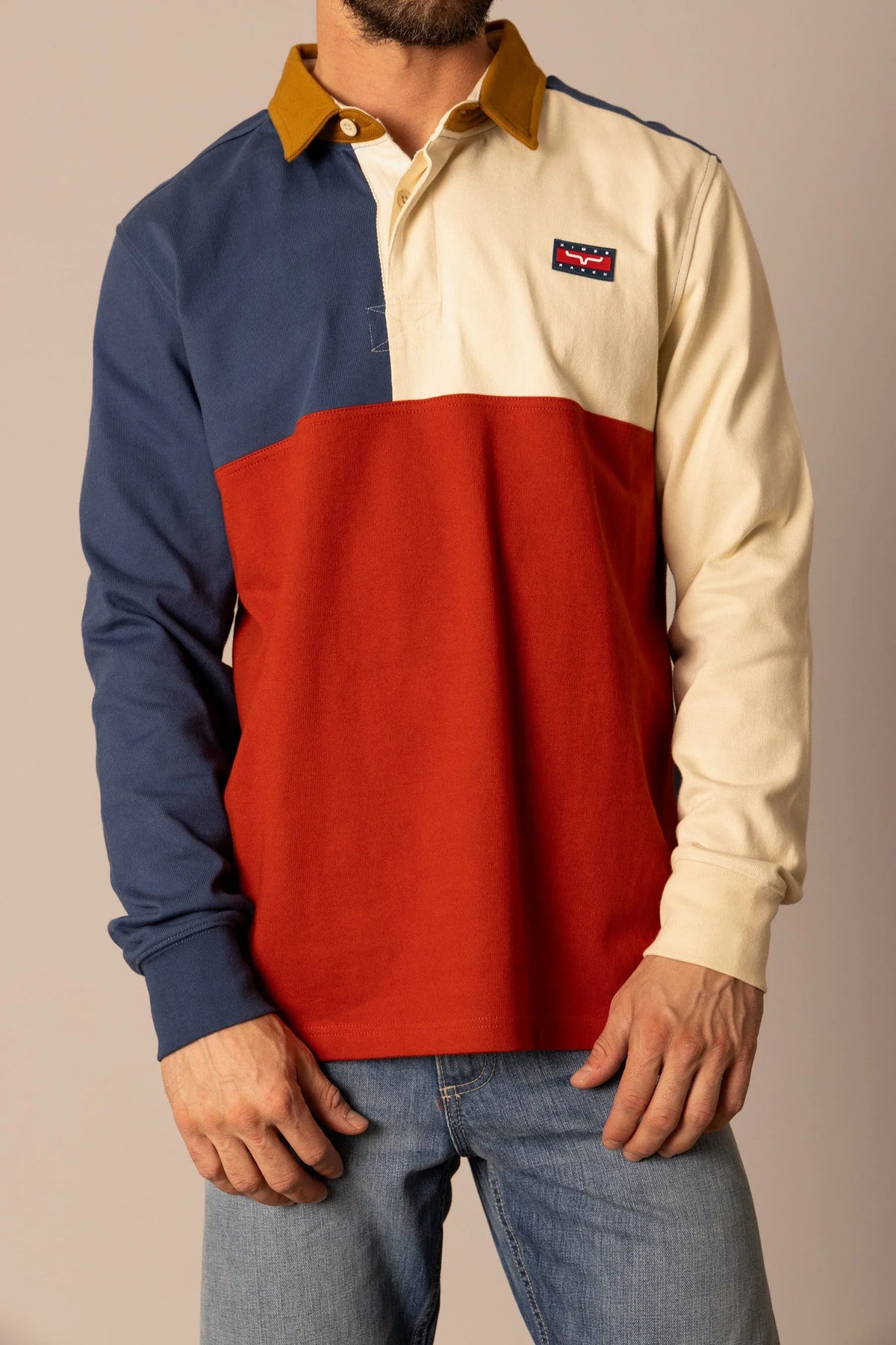 Kimes Ranch Marx Rugby polo in Dark Blue with cream and red color blocking and a mustard collar