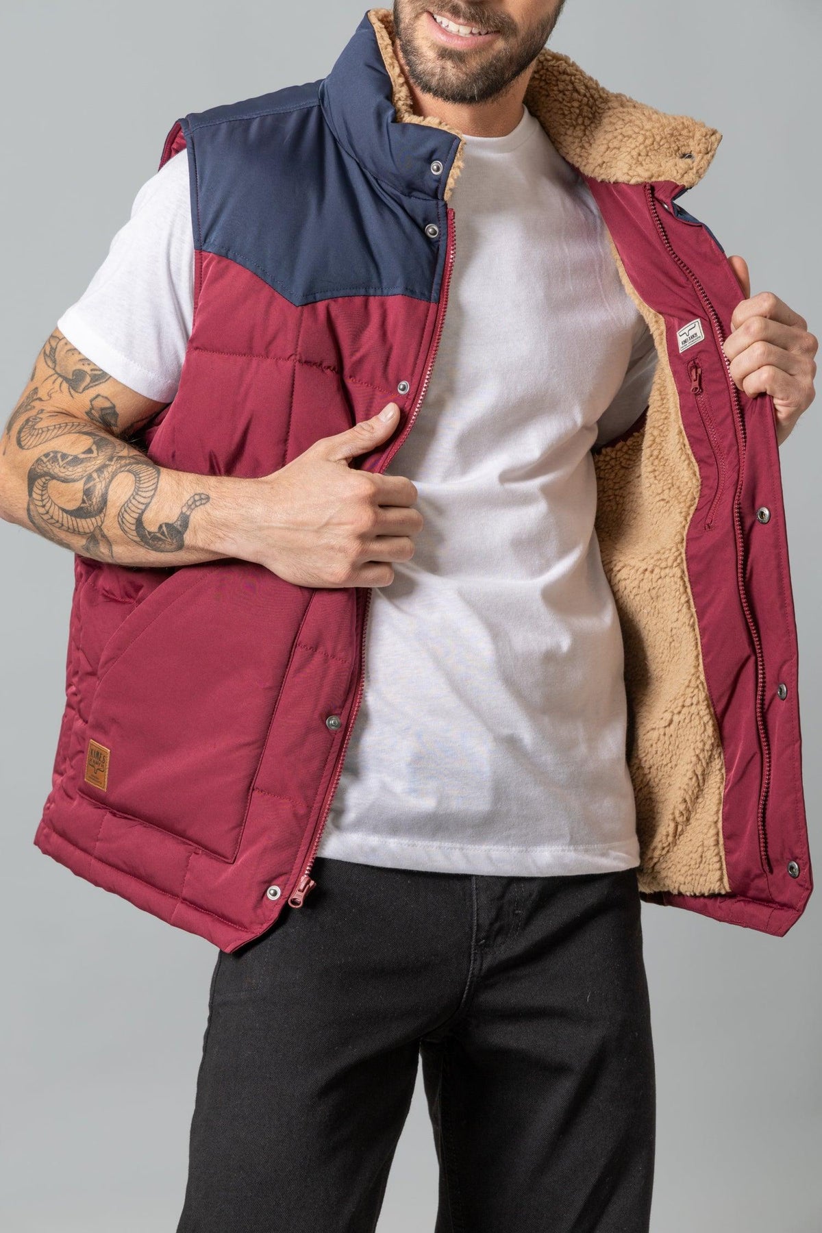Kimes Ranch Muir Trail Vest in Burgundy with navy yoke and tan sherpa lining
