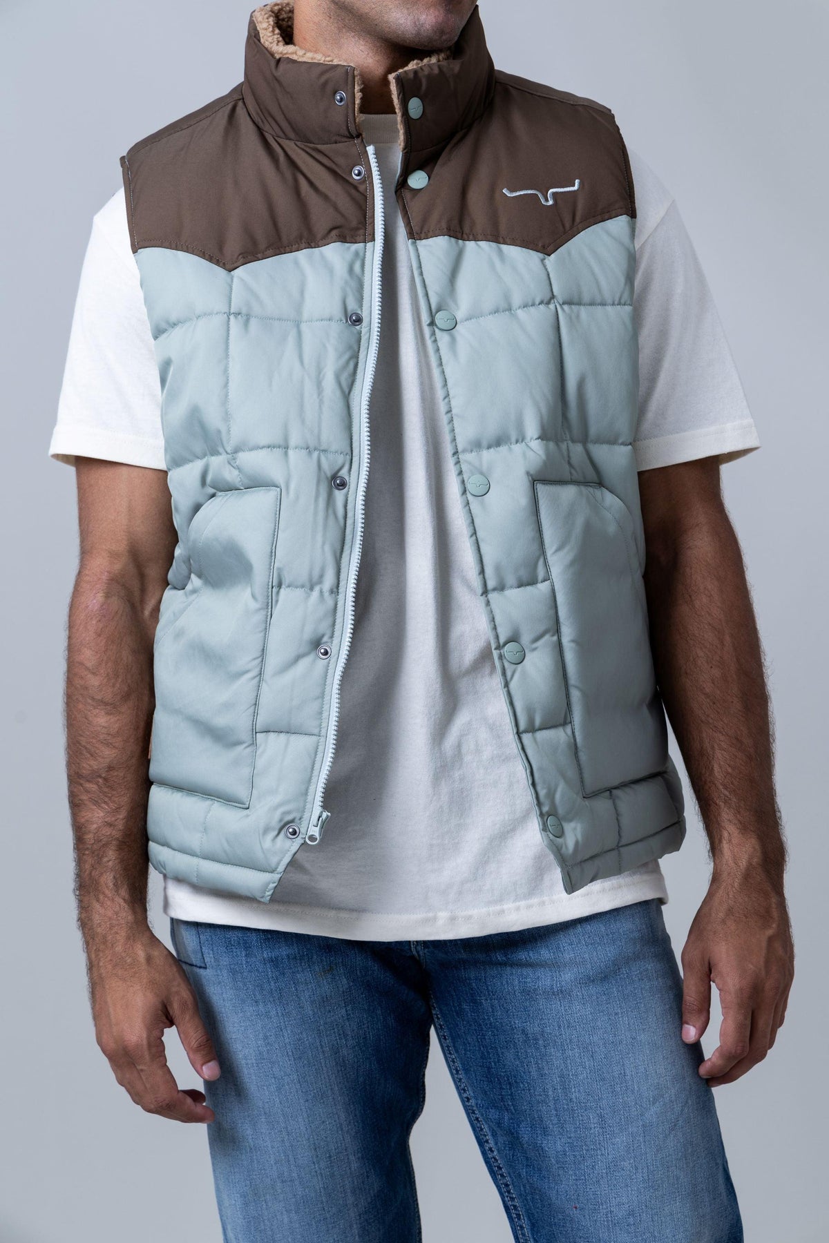 Kimes Ranch Muir Trail Vest in Sage with brown yoke and Kimes Ranch logo