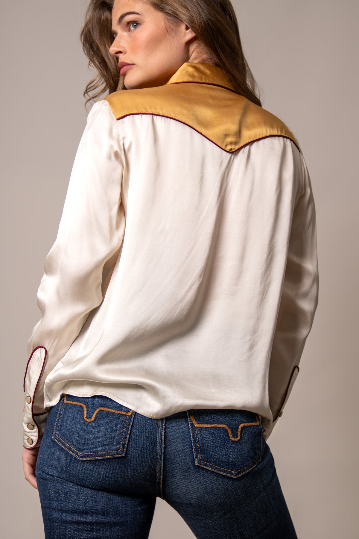 Kimes Ranch Merada top in Soft Gold, back view, with a back yoke and contrast stitching
