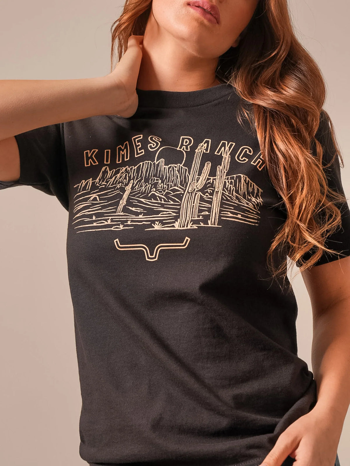 Kimes Ranch Mountain Badge shirt in Black with a desert landscape graphic and the Kimes Ranch logo