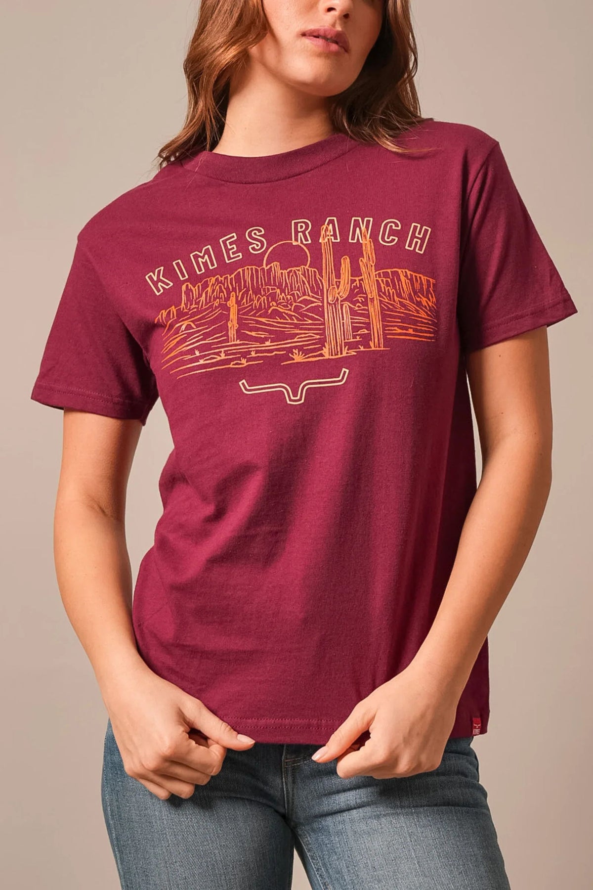 Kimes Ranch Mountain Badge shirt in Burgundy with a desert landscape graphic and Kimes Ranch logo