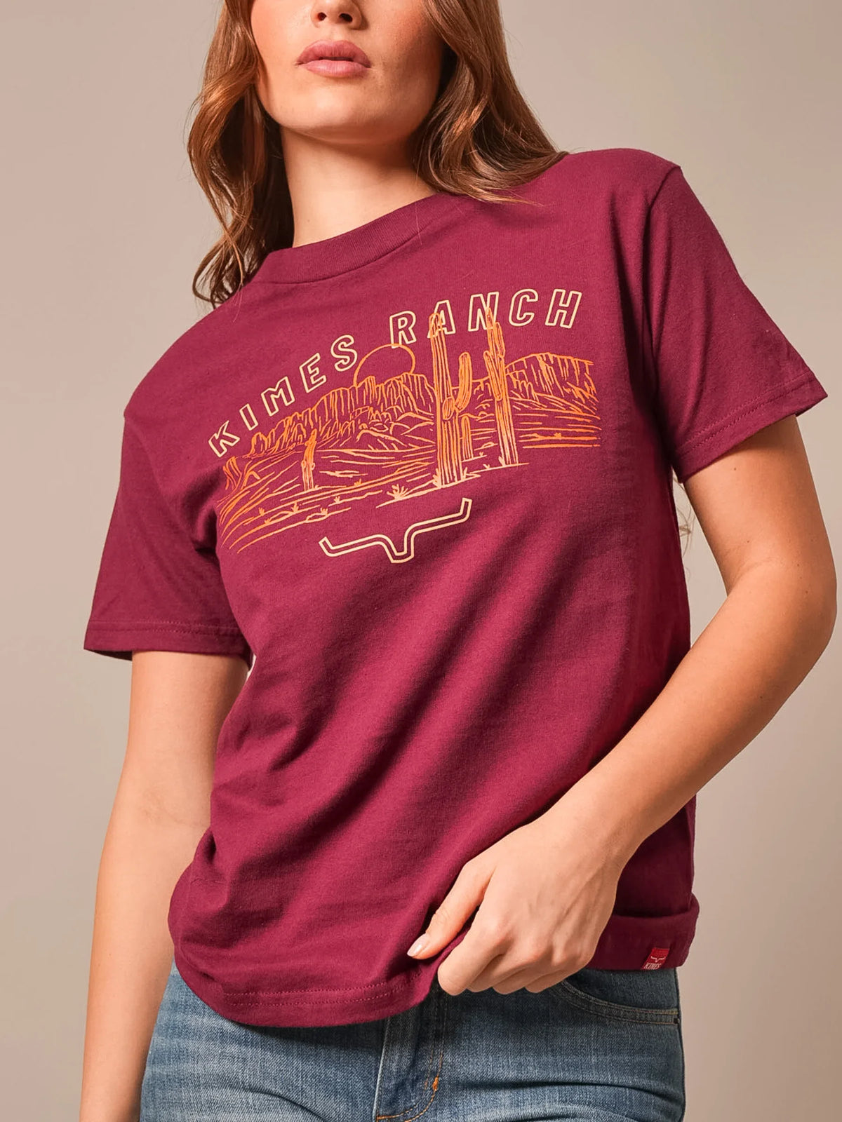 Kimes Ranch Mountain Badge shirt in Burgundy with a desert landscape graphic and Kimes Ranch logo