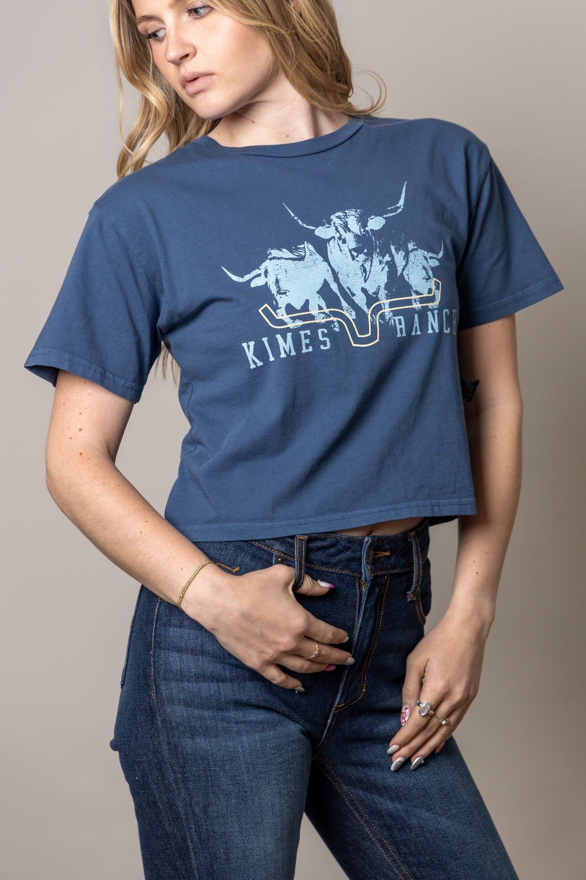 Kimes Ranch Movin' Out shirt in Dark Blue with a graphic of three longhorns and the brand name