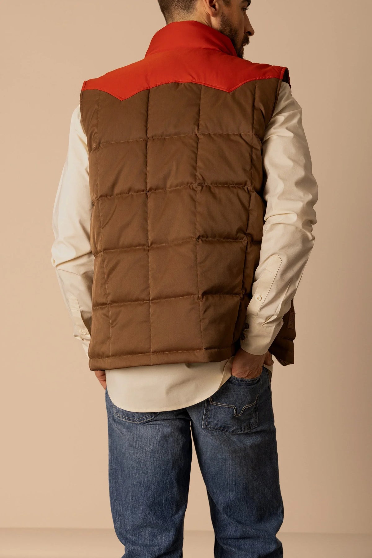 Kimes Ranch Muir Trail Vest in Brown, back view, with a red yoke and horizontal quilting