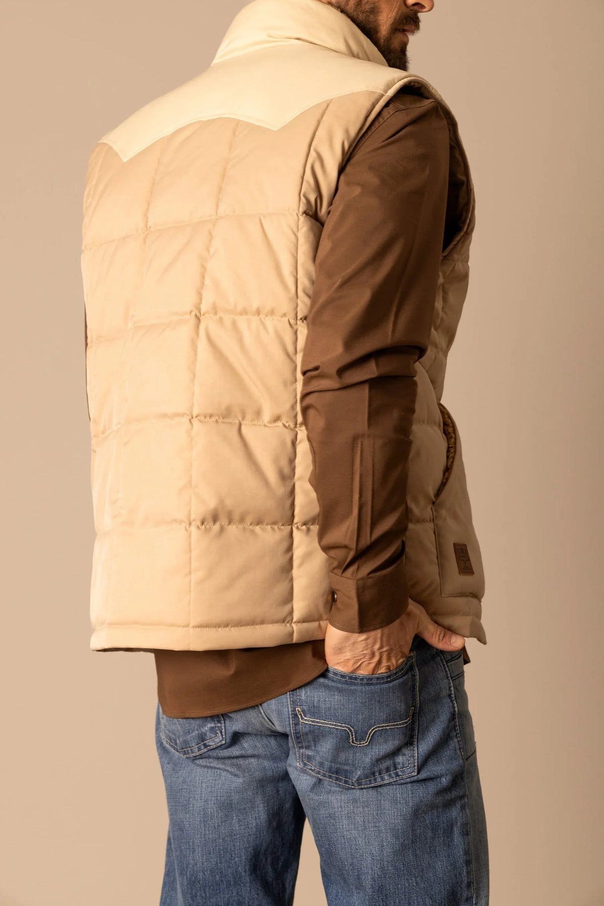 Kimes Ranch Muir Trail Vest in Khaki, side view, with a quilted back yoke and side pocket