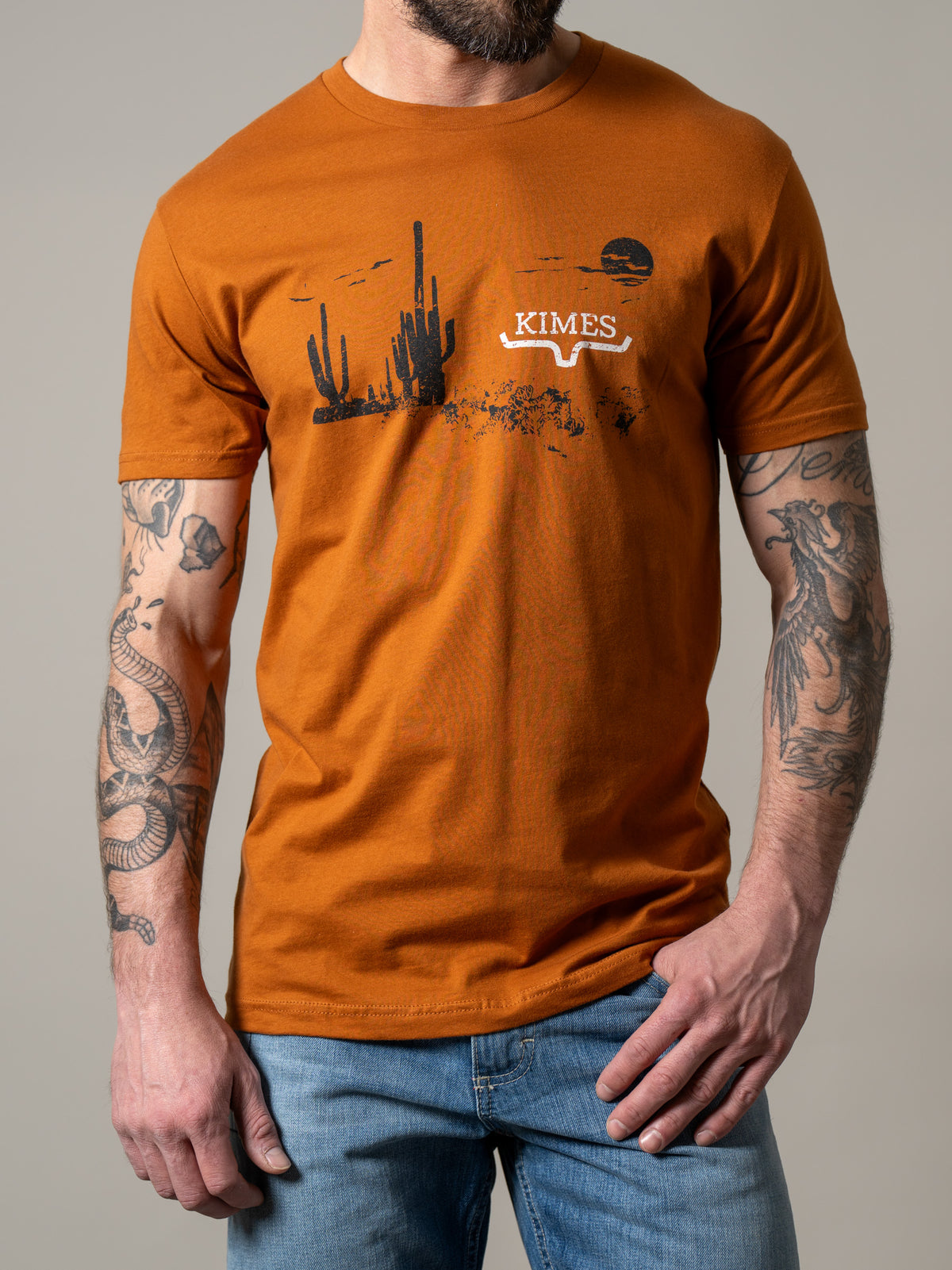 Kimes Ranch Night Fall shirt in Clay with a desert scene graphic and the Kimes Ranch logo