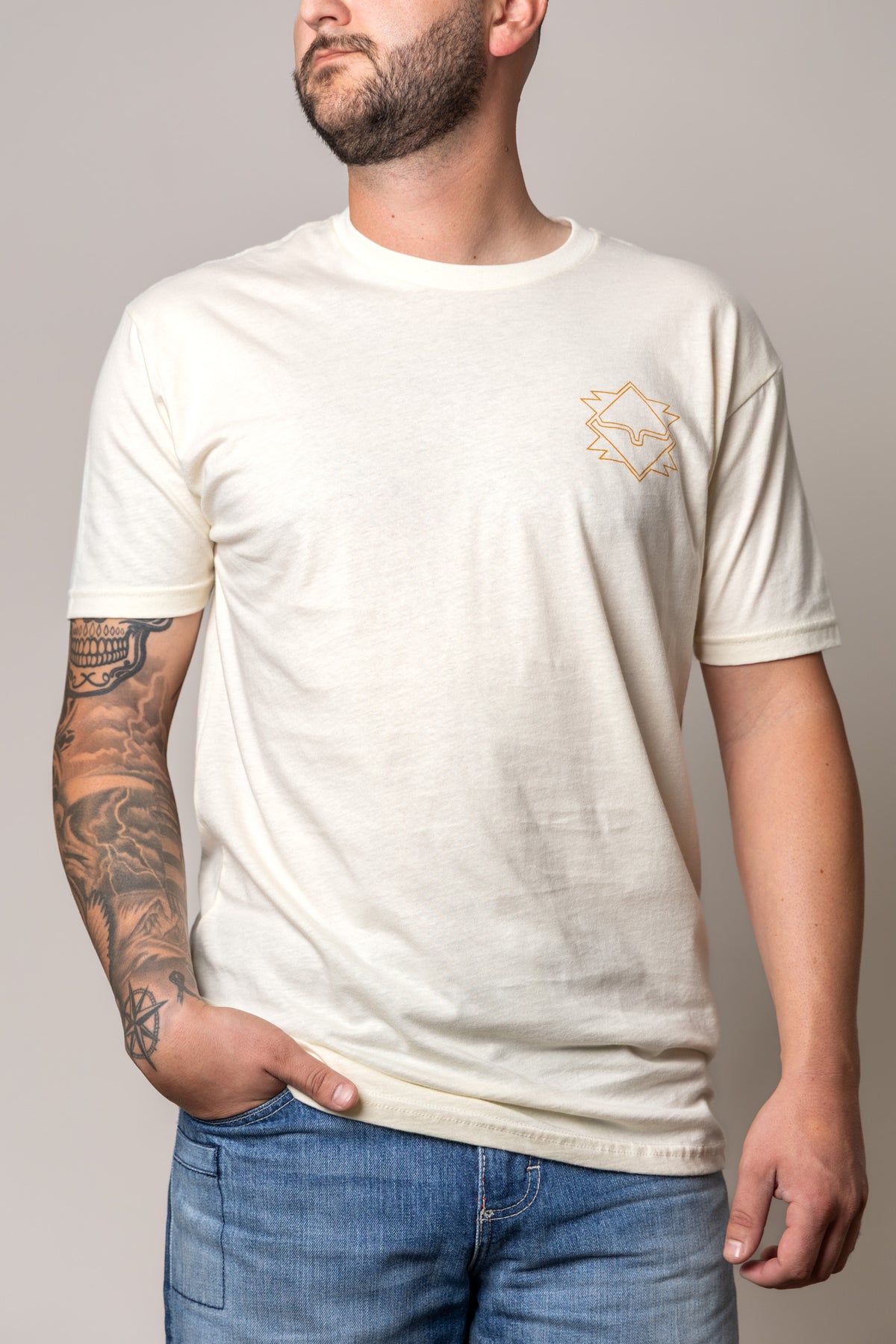 Kimes Ranch North Star shirt in Natural with short sleeves and a chest logo