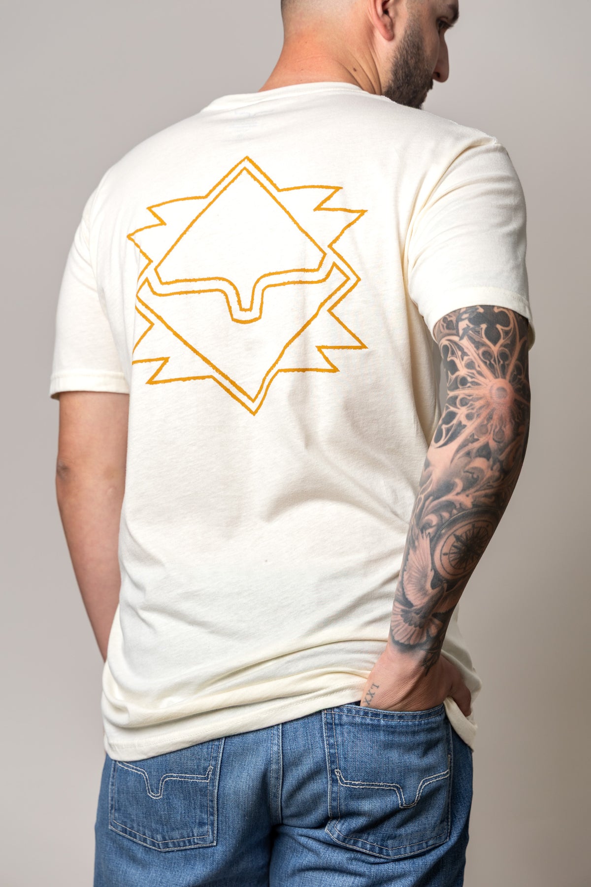 Kimes Ranch North Star shirt in Natural, back view, with a large geometric star graphic on the back