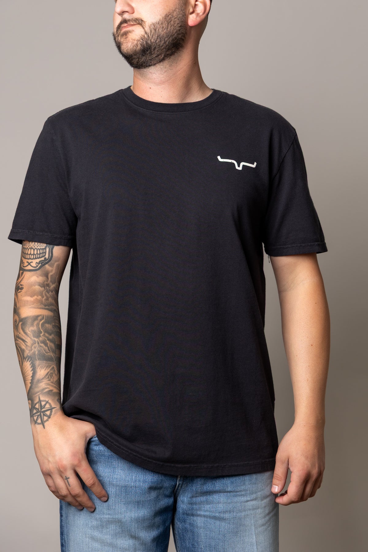 Kimes Ranch Not Our First shirt in Black with a white logo on the chest