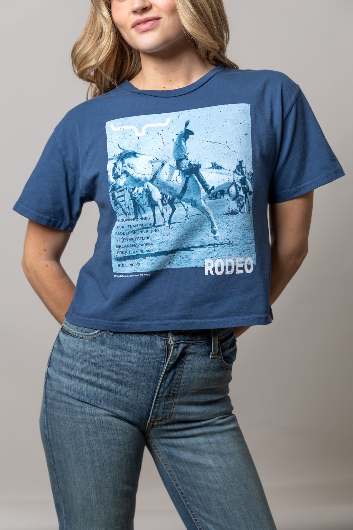 Kimes Ranch Not Our First shirt in Dark Blue with a rodeo graphic and RODEEO text