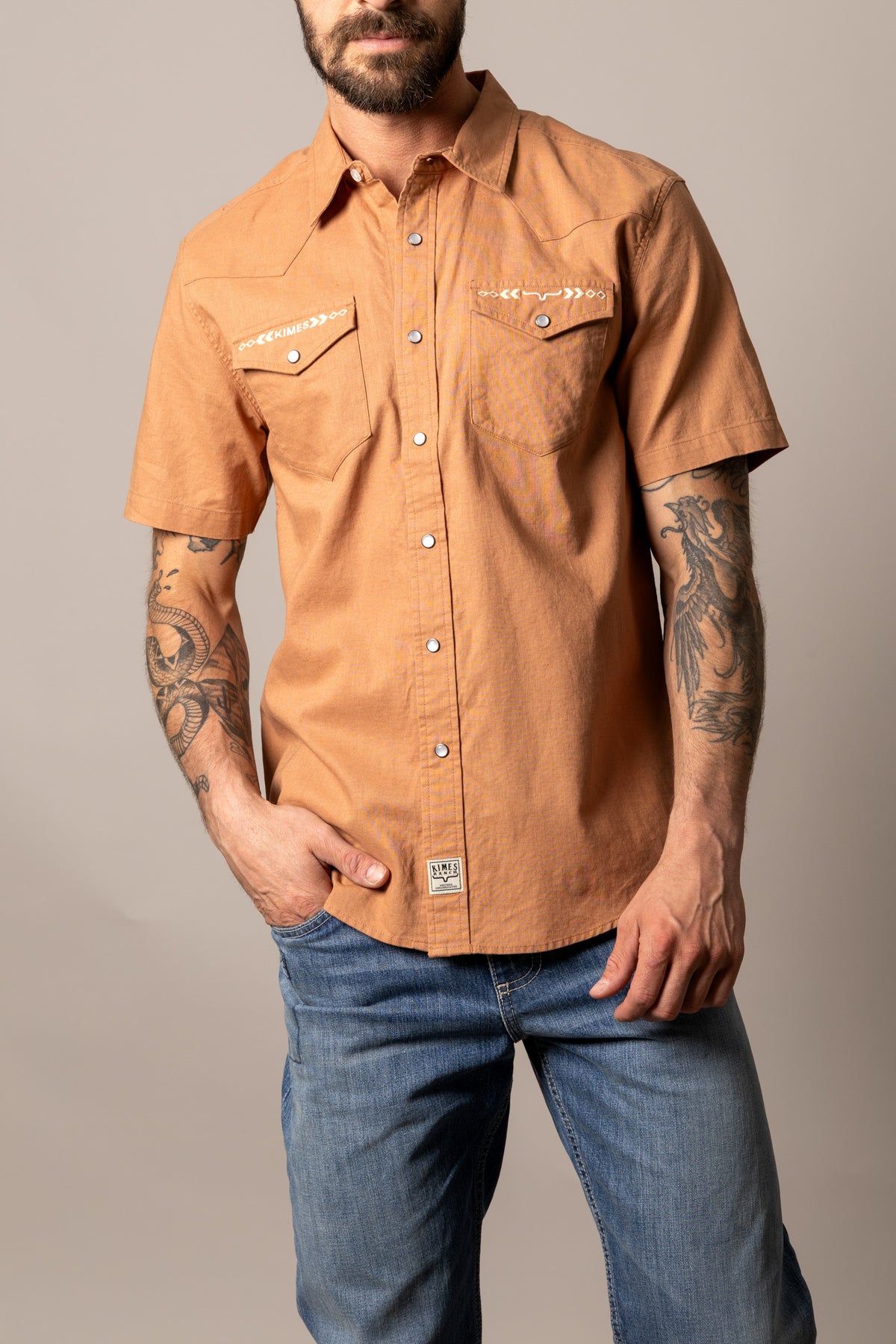 Kimes Ranch Nuce short sleeve dress shirt in orange with chest pockets and a logo patch