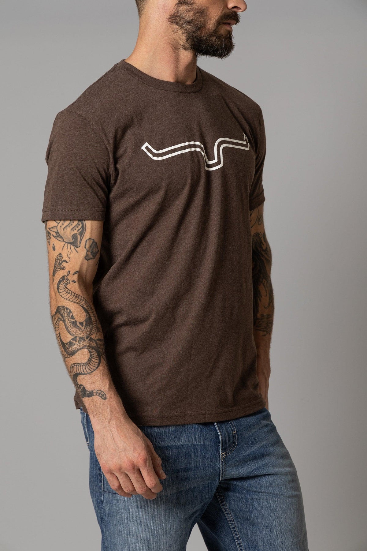 Kimes Ranch Outlier Shirt in Espresso, side view, with a white wavy line graphic on the chest